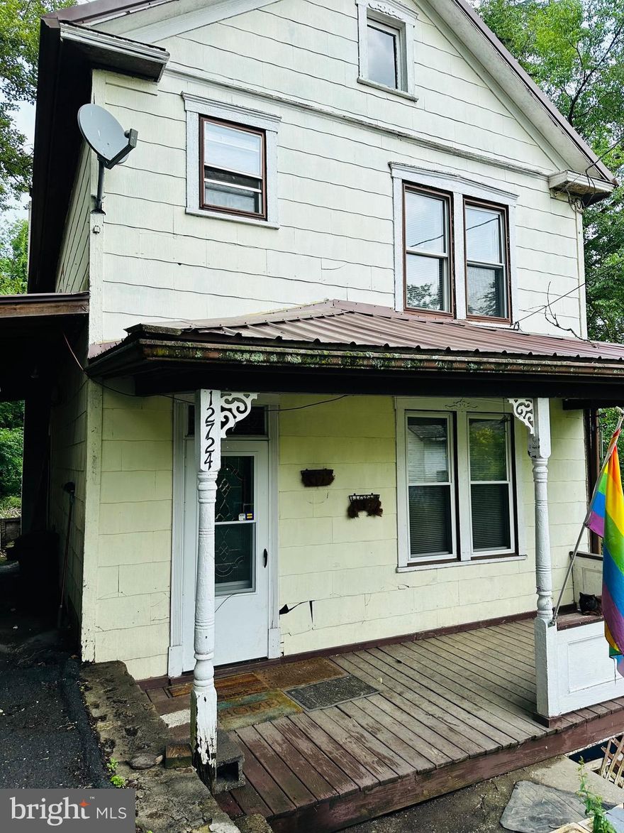 Welcome to Cobblestone Road! With a little love and some TLC, this could be your perfect home. Three bedrooms upstairs with a full bath, kitchen, living and dining room downstairs. The house is hidden by trees on all sides for privacy. Nice front porch and small back deck. Plenty of room in the kitchen and a nice little breakfast area off the kitchen with a ton of cabinet storage.  There are original hardwood floors.