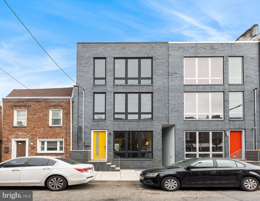 Welcome to 729 Carpenter Street, a luxury, ground-up, new construction home that sits on a 91 foot deep lot in the heart of Bella Vista. This 4 Bedroom, 4 Bathroom masterpiece boasts a little over 4,000/SF of living space (including the finished basement), high ceilings, a roof deck with unrivaled 360 degree views of the city, a 21 foot wide by 37 foot deep back yard with a putting green and an approved 10 Year Tax Abatement! Walk through the front door and into an amazing  super wide living space where you will find solid white oak flooring throughout, floor to ceiling marble surrounded linear fireplace and plenty of space for a large dining table to accommodate those dinner parties you always dreamed of. The kitchen is expansive, semi-custom white shaker cabinets go from floor to ceilinged are accented by Calacatta quartz countertops that run up the backsplash and waterfall off of the island. Stainless steel Bosch appliances will bring out your inner chef and include a 36” cooktop in the island along with a double wall oven. The wine fridge and bar sink in the island make it convenient to entertain guests as you walk through your floor to ceiling glass door sliders out onto your urban oasis for a back yard! I dare you to find a larger one on the market. A custom single steel stringer staircase with solid oak treads and a glass railing will lead you up to the 2nd Floor where you will find two large bedrooms, each with plenty of closet space and their own, stylish, ensuite bathrooms. As you walk up the stairs to the 3rd Floor, a modern chandelier suspends from the ceiling down the atrium to make the space feel light and bright. At the top of the stairs you will find a sun-soaked extra living space with a wet bar and a wine cooler that can also double as an office or workout area when not entertaining. Right behind the living space is your laundry room with a side by side washer and dryer. In the rear, you will find the Primary Suite, with a wall of glass that overlooks that huge private back yard. The Primary Bath is outfitted with a double vanity, a large modern, spa-like shower with matte black fixtures that include a huge waterfall rain-head, regular shower heads, a wand and body sprays. The stairs outside the Primary lead up to the roof deck that provide jaw dropping views from every angle. Downstairs you will find a fully finished, porcelain tiled basement with a bedroom, full bathroom and and an additional living room with a linear fireplace. With over 21 feet of width and a rear wall full of glass, 729 Carpenter Street is a sun drenched, one of a kind build on a phenomenal block in Bella Vista. With a WalkScore of 98, this home is located in a Walker’s Paradise. It is just steps away from Bella Vista’s best amenities, including the Italian Market, Grace & Proper, Function Coffee Labs, Angelo’s Pizzeria, Whole Foods, Fiorella, The Good King Tavern and much much more.