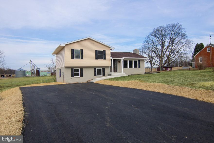 Welcome home! This beautiful split level is tucked in the picturesque Clear Spring countryside. This home has been NEWLY RENOVATED! Renovations include a new roof, windows, HVAC system, plumbing, and updated wiring and electrical service. Upon entry there is an open living area with a fireplace. The kitchen offers an adjacent dining area and brand-new stainless steel appliances. The large lower level is open and can become a second living area, rec room or oversized primary bedroom with an accompanying laundry room and half bath. The upper level offers two bedrooms, a stunning full bath, and primary suite with accompanying second full bath. There is gorgeous recessed lighting throughout with ceiling fans offered in many rooms. This home offers new carpeting and vinyl plank flooring throughout. Enjoy a relaxing evening with gorgeous mountain views on the brand-new back deck! Make this house your home today!