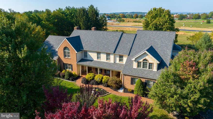 Welcome to this spacious and inviting home on 1.75 acres ideally located in the Stonehenge community of Manheim Township and situated just minutes away from Bent Creek Country Club. Featuring an oversized driveway large enough for an RV, this property offers the perfect blend of convenience and grandness. Upon entering, you will be impressed by the abundance of space the home has to offer. With six bedrooms, there is plenty of room for everyone in the family, as well as guests. Highlighting the home is a unique and huge two-story great room perfect for fun and games and so much more. The kitchen is a chef's dream, featuring a gas stove top, double ovens, granite countertops, stainless steel appliances, and a cozy breakfast nook. The layout is perfect for preparing meals and hosting dinner parties. Off the kitchen is a bright sunroom offering an additional area to relax and entertain. Also adjacent to the kitchen is a family room providing space for TV and a view of the peaceful backyard. A unique feature of this home is the bonus room on the back of the main level that has its own private entrance and opens to the patio as well. This flexible space can be used as a home office, studio, or even a guest suite. With two wood-burning fireplaces, the kitchen and family room become the heart of the home, creating a warm and inviting atmosphere for gatherings and cozy nights. To make communication within the house easy, there is an intercom system, allowing you to reach other areas of the home with the touch of a button. With the impressive size of the home in a prime Manheim Township location, don't miss the opportunity to make this beautiful property yours!