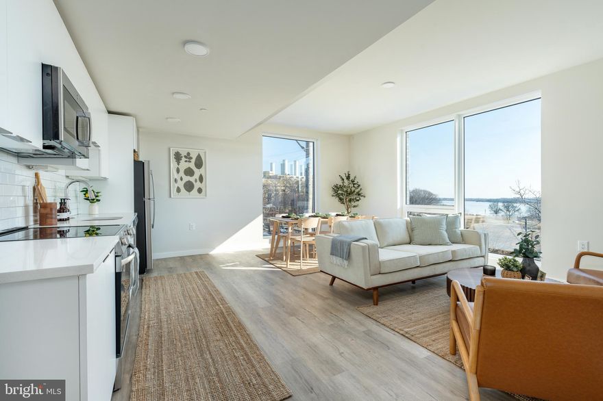 Introducing The Rope House! Now offering 3 months free on a 15+ month lease (list price reflects net rent with leasing special / base rent is $3450/month).  Discover the epitome of modern living in this stunning brand-new construction building, perfectly located in vibrant Fishtown. Situated on the 3rd floor, this sleek and sophisticated unit boasts floor-to-ceiling windows that offer breathtaking views of the Delaware River and Penn Treaty Park, flooding the space with natural light. Step into a thoughtfully designed kitchen that showcases high-end finishes, including quartz stone countertops and soft-close, flush-mounted modern cabinetry. Equipped with brand-new stainless-steel appliances—a range, refrigerator, microwave, dishwasher, and garbage disposal—this kitchen is as functional as it is stylish, offering plenty of storage and workspace for all your culinary needs. 
The open living area leads to a sizable bedroom with ample closet space, and more floor to ceiling windows with scenic river and park views. Access your bathroom from your living space or bedroom -  nice balance of comfort and functionality. The luxurious full bathroom comes equipped with a standing shower, sleek vanity, and modern finishes. 
Living at the Rope House means more than just having a beautiful apartment—it’s a lifestyle. This building offers incredible community features, including: State-of-the-Art Fitness Center (Equipped with Peloton bikes, Pilates reformers, treadmills, rowers, cross-training machines, and dumbbells up to 100 lbs), Pet-Friendly Perks (Pamper your furry friend with a complimentary Dog Spa, featuring wash tubs and treats, as well as a convenient Pet Rest Stop for late-night walks), Social Spaces (A stylish lobby with a fireplace lounge, complimentary coffee station) Co-working areas, multiple outdoor spaces, and even a speakeasy! The building also offers access to Amazon lockers and a marketplace store right in the building, giving you tons of convenience  

Nestled in the heart of Fishtown, this apartment offers unmatched convenience to some of the city’s best dining, shopping, and nightlife. You’ll be just steps away from local favorites like Front Street Café, Garage, Frankford Hall, Middle Child Clubhouse, Milkcrate Café, and more.
This home combines high-end design, stunning views, and unbeatable amenities, making it a standout in the Fishtown rental market. Schedule your tour today and experience a new standard of urban living!