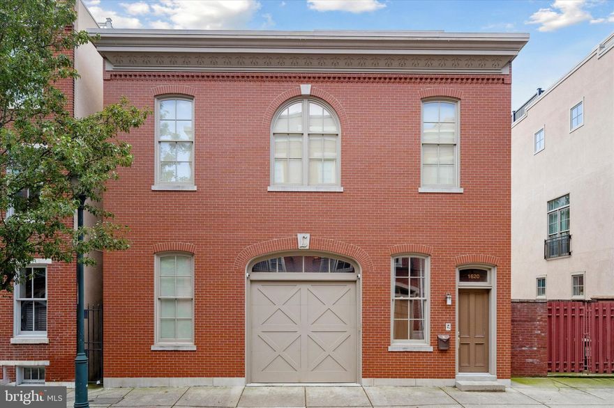 Unbelievable attention to detail with all the finest materials can be found in this one-of-a-kind historical carriage house on one of the most prestigious blocks in the Art Museum area. Spectacular in presentation and scale, the original carriage house was completed circa 1886 and is a fully detached 34-foot-wide pinnacle of luxury living. Superior workmanship can be seen throughout this unique home with soaring 12-foot ceilings and vast spacious rooms. This sophisticated residence features video intercom and security systems, built-in surround sound in every room, smart lighting that can be adjusted to your specifications with one touch, dual-zone HVAC, and a central vacuum system. Throughout the home, you'll find wide-plank floors of prefinished oak and huge wide custom wood windows. The first floor's open concept includes a high-quality custom design. The kitchen boasts a tremendous cook's kitchen, granite countertops, custom cabinets, stainless steel appliances, a wine refrigerator, a center island with sink, and stainless pendant lights. The spacious dining room, adjacent to the kitchen, features an exquisite chandelier. In the living room, a gas fireplace serves as the centerpiece for a custom built-in entertainment system. This wide living room allows for easy entertaining. A half bath and a deep coat closet complete this floor, along with an exterior door to a private slate rear patio with abundant garden planters and a high wall for unmatched privacy. The second floor boasts suite-style bedrooms with custom closets and brilliantly designed bathrooms with rainfall showers, marble vanities, and a designer color scheme. The hallway features a stunning metal chandelier. The impressive owner's suite has a gas fireplace surrounded by woven glass tile & copper trim, doors to a Juliet balcony overlooking the patio/garden, and two spacious walk-in closets. The ultimate in tastefully curated design is the en-suite bathroom with a free-standing porcelain tub, a luxurious rainfall shower fully enclosed in glass, designer marble tile with an inlaid sparkling gem motif, and a marble double vanity. On the third floor, you’ll find a wet bar with a wine refrigerator and access to a large Trex deck with breathtaking views of Center City. Back on the ground floor, you can park an oversized vehicle in the expansive garage at the front of the home, plus there are 2 additional parking spaces located at the rear adjoining patio. All 3 parking spaces are secured & operated by remote control. Live your best life at 1620 North Street. This is truly one-of-a-kind luxury living!
