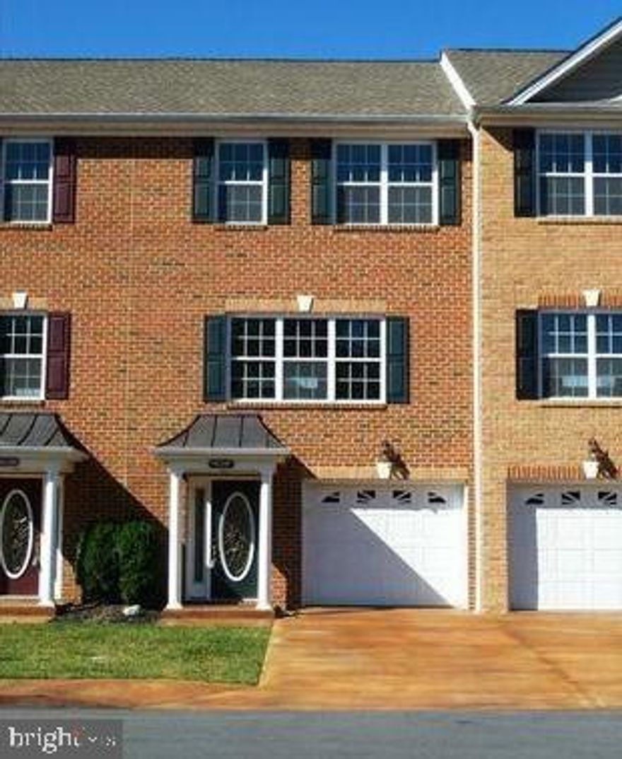 Come home to this beautiful upscale townhome in Inwood, WV just minutes from I-81, shopping, and restaurants.   A distinguished home for those who appreciate a little more quality in their life with this easy living, child friendly, small neighborhood. This home starts with an acid-stained concrete driveway, walks, and porch. The front porch has a real copper roof with columns. The front face of the townhome has over-sized brick with keystones, dental molding, and the roof has 50-year shingles. Around back you'll find an acid-stained concrete patio, attached storage shed, bricked foundation, beaded siding, high-efficient heat pump, and all buried downspouts. Walking in the front door you'll find a beautiful oval glass door with side light, ceramic tile foyer, chair rail, level five drywall finishing, and new two-toned paint. The garage is finished with semi-gloss paint, vinyl baseboard, acid-stained floor, and insulated garage door with windows and opener. Lower level has the fourth bedroom, rec room, or office in the rear. Going upstairs you'll find the staircase with solid oak railing. Once you step into the luxurious well-appointed kitchen, you'll see convenience was in mind with the corner walk-in pantry, very nice tall cabinets with crown molding, dove tail solid wood drawers, granite counter tops, new tall pull-out faucet, recessed ceiling lights, chair-rail, enhance, and new two-tone semi-gloss paint. French doors with a transom window which leads out to the composite deck with blind fasteners and vinyl railing. Walking towards the gorgeous living room you will also find, chair-rail with new two tone paint, a half bath (powder room), ceiling fan, and crown molding. This level has 9-foot ceilings, all solid oak hardwood flooring throughout, Advan-Tech sub-flooring (waterproof OSB). All party walls are double insulated for noise control and efficiency. Going upstairs to the bedrooms you will find two full baths and three bedrooms. The owner's bedroom has a vaulted ceiling, ceiling fan, chair rail with new two-tone paint, walk-in closet, and a full bathroom with ceramic tile flooring. The full hall bath has ceramic tile flooring, and the included washer and dryer in a concealed area. There are two additional nice sized guest bedrooms. There is new carpet. You will love coming home to this charming home and proud to invite your friends and family over.

 Winchester Va. is approx. 20 mins away, Berryville Va. Rt. 7 is 20 mins., Hagerstown Md. 25 mins., Frederick Md. 40 mins.