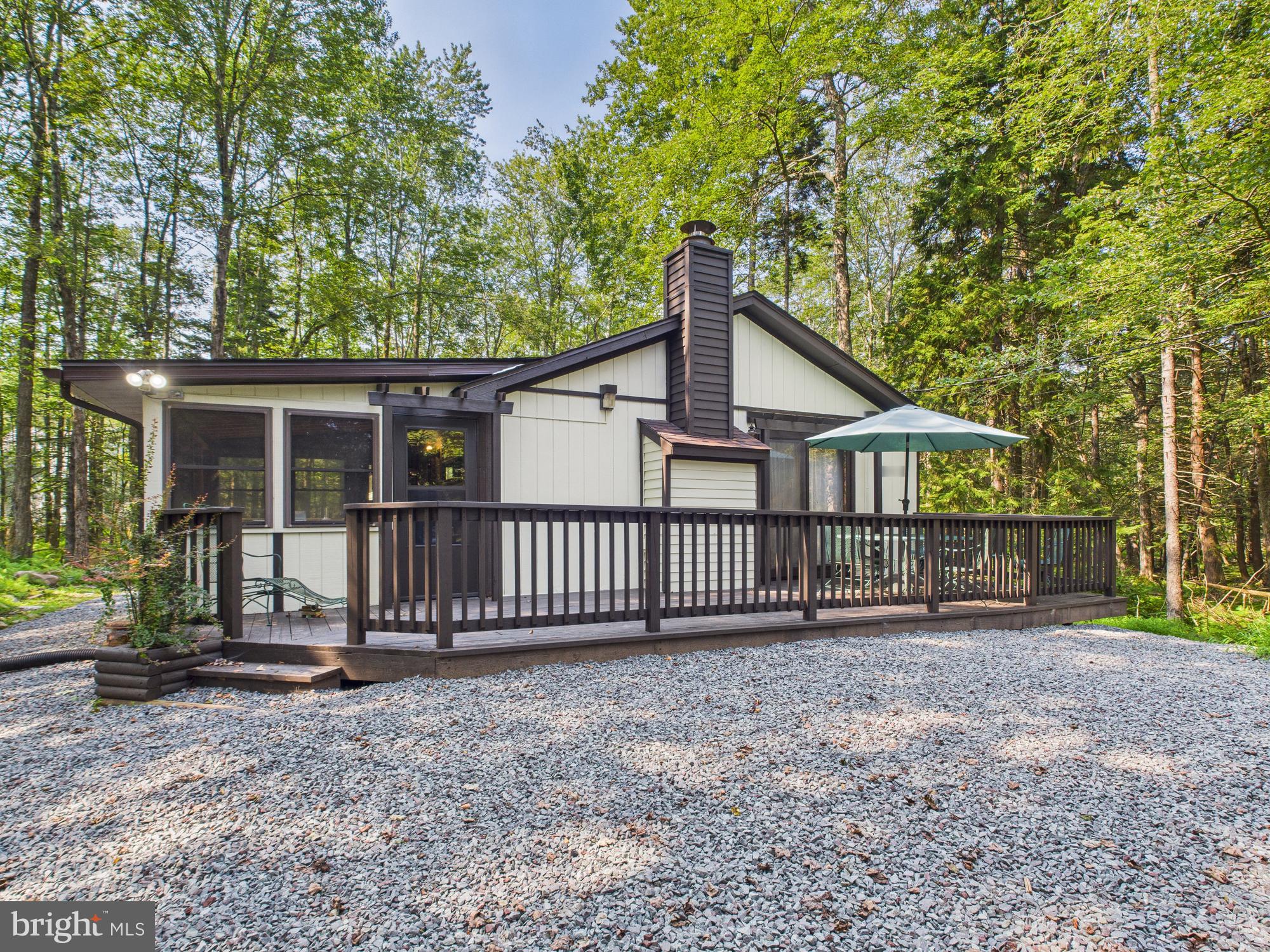 Ranch home in the gated, amenity-filled community of Arrowhead Lake. This home is on a greenbelted lot of 2.15 acres on a cul-de-sac! Home is 3 bedrooms, 1 bath and has a deck with a 3 season room. Living room has a propane fireplace. Dining area has sliders to the front deck. Kitchen has an eating bar, 2 sinks and laminate floors. Bar area with a wet sink. Full bath has a stackable washer/dryer. Three bedrooms complete the home with one having sliders to the back deck. Outside features a stone driveway, a shed and an oversized green belted lot. Walking distance to pool! Very private location! Extras include new grinder pump, new decking, new roof in 2025, and home on community sewer.
Arrowhead Lake is a gated community with security, 3 heated swimming pools, 2 lakes for fishing/swimming and boating, tennis courts and bocce ball. Many of these activities have occurred over the years including bonfires, carnival, Zumba, water aerobics, swim team, potluck dinners/breakfast and summer camp.