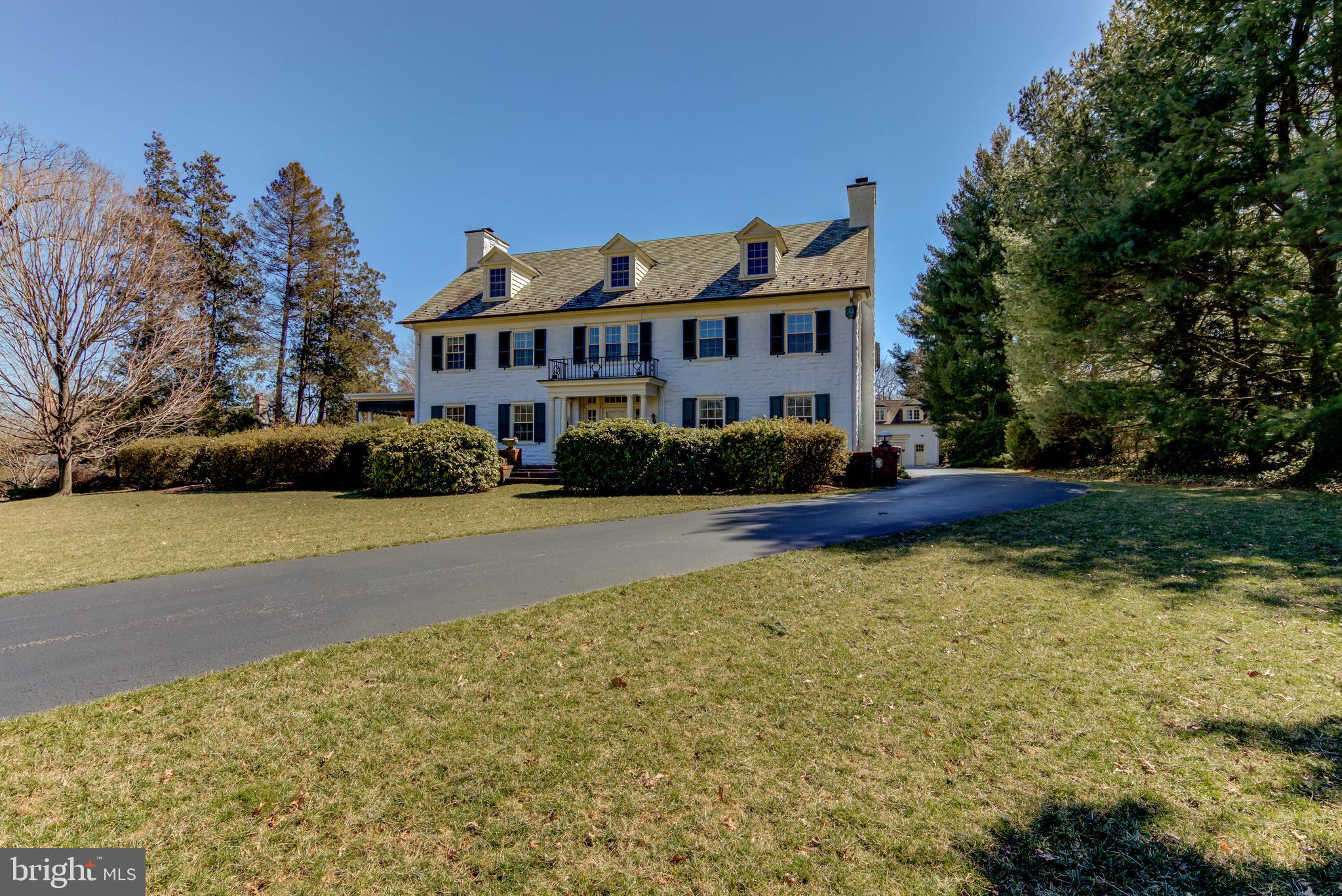 Unbelievable Price for this outstanding Turn of the Century Colonial Manor Home sitting prominently on an exceptional 3.5 acres in the heart of the prestigious Walnut Avenue neighborhood in the community of Wayne. Dating back to 1912 This Iconic Home features old world charm and unparalleled craftsmanship with Grand Size Rooms and beautiful woodworking throughout. Interior features include a very large Gracious Center Hall with impressive staircase and pillar columns flanking the entrance to a Formal Living Room with Original Hand Carved Fireplace with two sets of French Doors leading to wonderful covered porch overlooking magnificent side and rear grounds. An elegant Dining Room with fireplace adjoining a large Butler's Pantry, a gourmet Kitchen with top-of-the-line appliances,beautiful cabinetry, expansive granite island, beautiful mudroom with built in cabinetry , a large pantry closet and back door to rear grounds and circular driveway. Their are cased openings to Breakfast Room which opens to a large Family Room with wet bar connecting to a beautiful Sun Room surrounded with walls of windows, and a custom tile fountain. A private powder room off the center hall completes this level. The second floor features a fabulous master bedroom suite with a luxurious remodeled master bath with double vanities and large whirlpool tub, separate shower and commode room and a 2nd laundry area. Master bath connects to a lavish walk in closet adjoining a lovely sitting room with built-ins. There are three other family size bedrooms with two newer baths, an office or sitting room and back stairs to the kitchen . Continue to the Third floor with a lovely guest suite with a great view of the grounds and two other multi purpose rooms or additional bedrooms with a hall bath, large cedar closet and beautiful old world built in cabinets and drawers for great storage. The large basement houses the system of the house, multiple storage rooms, an additional powder room , laundry room and a separate outside entrance. The exterior offers total privacy with magnificent mature landscaping and gardens, room for a pool, an expansive circular drive and beautiful expansive front terraces and a covered side porch adjacent to the house. There is a separate 3 car garage with a lovely one bedroom apartment above the garage, featuring its own kitchen and sunny living room with great views of the grounds,private bedroom with one bath. A versatile floor plan and wonderful flow make this home perfect for both active family living as well as entertaining. Offering all the amenities of a newer home combined with the charm and elegance found only in an older home, this exceptional home is conveniently located in the heart of the Main Line walking distance to downtown Wayne and the local shops, restaurants and train station, and it is within close proximity to all major highways for commuting to Center City or the airport.Please note that Delaware County is conducting a real estate tax reassessment, effective January 1, 2021. If you have any questions or concerns about the impact of this process on the future real estate taxes for this property, you should contact the Delaware County Treasurer's Office or call the Tax Reassessment Hotline at 610-891-5695.Check out our video tour! https://youtu.be/UrKh6qxyx2U.