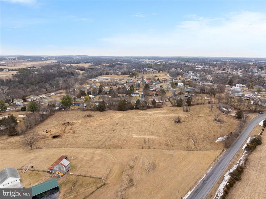 Rare opportunity in the heart of Middletown! Discover the perfect blend of small-town charm, open space, and future potential on this beautiful 8-acre property surrounded by scenic pastureland and mountain views. Currently used for cattle and hay production, the land is partially fenced and includes a shed, making it ready for agricultural use or the ideal setting for your own private farmette—bring your animals and start living the country lifestyle.

Imagine building your dream home while enjoying the peace and wide-open space this property provides. With town water and sewer hookups available or you could do well & septic  - depending on costs .  you’ll have the convenience of municipal services while still enjoying the feel of rural living. Zoned RA, the parcel may offer up to three homesites (buyer to verify)—perfect for a family compound, custom home sites, or a long-term investment opportunity.

Located just a short walk to historic Main Street, you can easily enjoy local restaurants, shops, and community events. Plus, I-81 is only minutes away, making commuting simple while you return home each day to your peaceful countryside retreat.

Opportunities like this are hard to find in Middletown. Schedule your showing today and explore the possibilities this special property offers. 

Property sold as-is. Buyer to verify subdivision potential, utilities, and zoning. Property is currently in land use; rollback taxes may apply if removed. Livestock on property—showings by appointment with agent accompaniment only.   The purchaser  could choose to do well & septic instead of hooking up to the public utilities


Q: Where is Middletown, Virginia located?
A: Middletown is located in the scenic Shenandoah Valley of Virginia, just south of Winchester and minutes from Interstate 81.

Q: What makes Middletown a desirable place to live?
A: Middletown offers small-town charm, historic character, and beautiful mountain views while still being close to shopping, dining, and commuter routes.

Q: What outdoor activities are nearby?
A: Residents enjoy easy access to hiking, fishing, and exploring the Shenandoah Valley, as well as nearby parks, rivers, and scenic mountain drives.

Q: Is Middletown convenient for commuters?
A: Yes. With quick access to I-81 and nearby Route 11, Middletown provides a convenient commute to Winchester and surrounding Shenandoah Valley communities.

Q: What is the lifestyle like in Middletown?
A: The town is known for its welcoming community, historic Main Street, seasonal events, and peaceful rural surroundings that make it a great place to enjoy the Shenandoah Valley lifestyle.