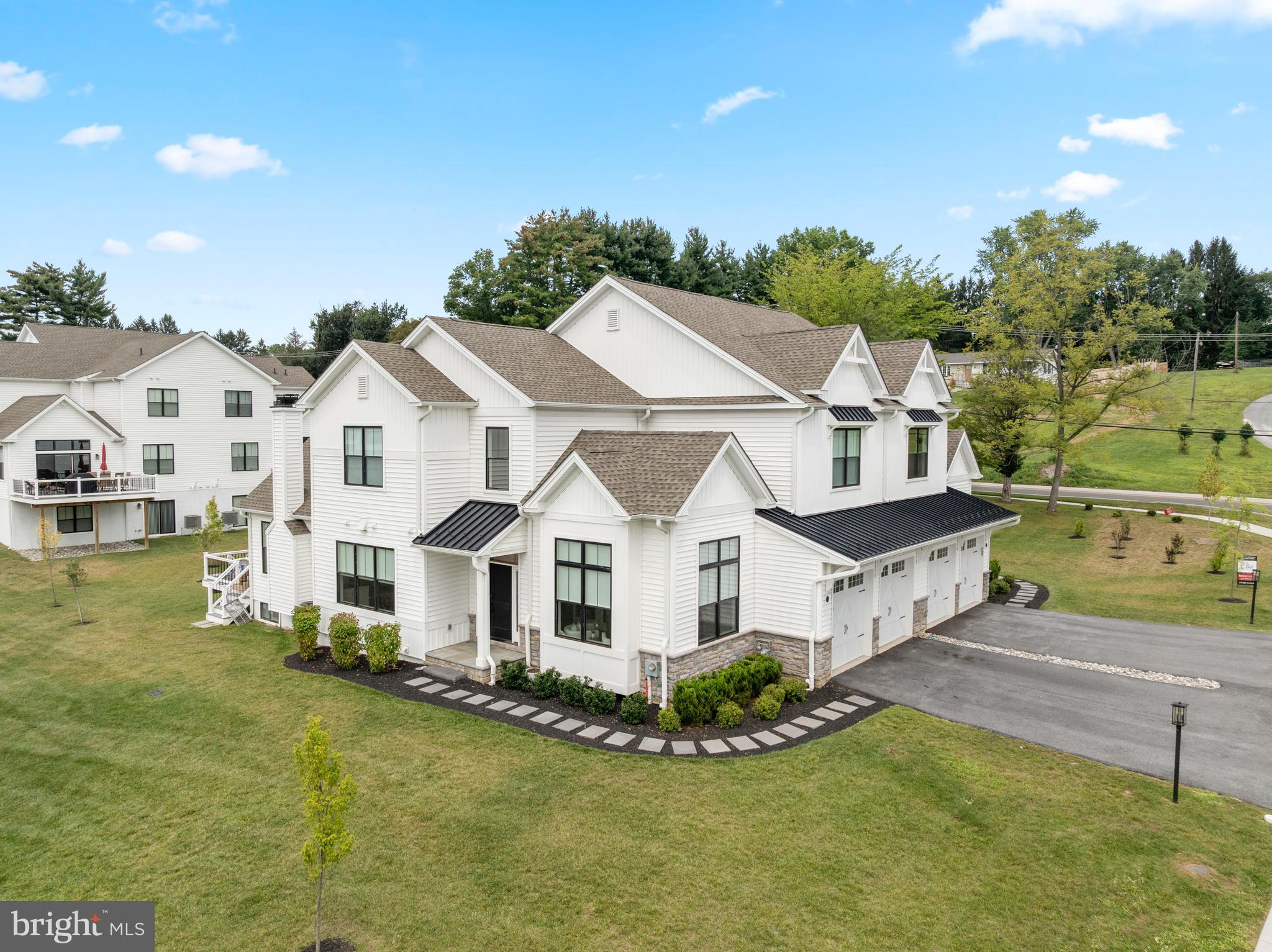 Welcome to 45 Sawmill Court, a stunning custom home in one of West Chester’s most desirable low-maintenance communities. Thoughtfully designed and extensively upgraded, this refined residence blends sophisticated finishes with modern comfort, offering the rare opportunity to own a turnkey property just two miles from the Borough of West Chester.
This sun-filled home features a first-floor primary bedroom suite with two walk-in closets and a spa-inspired bath complete with a large walk-in shower and upgraded finishes. The heart of the home is an elegant, open-concept kitchen featuring upgraded Century Carriage House cabinetry in a two-tone finish, a dramatic Level 9 Cambria Quartz Skara Brae island, Thermador range, refrigerator, dishwasher, microwave drawer, farmhouse sink, and a vented grotto hood. Soaring ceilings and walls of Marvin windows with sunny southern exposure fill the family room, kitchen, dining area, and home office with natural light.
Additional features include a fully finished basement with custom wine storage and built-in cabinetry, a stone fireplace that extends to the ceiling, primary bedroom ceiling beams, a first-floor laundry room with an interior closet, and an upgraded trim package throughout, featuring mudroom cubbies, a full 12’ shadow box wall in the study, and 6-inch baseboards. All bathrooms and the powder room are enhanced with upgraded countertops, tile, fixtures, and lighting.
Enjoy maintenance-free living with no lawn care, mulching, or snow removal responsibilities. This home backs to open community green space and is part of the award-winning West Chester Area School District, feeding to Rustin High School, Stetson Middle School, and Westtown-Thornbury Elementary. Convenient access to Route 202, Route 926, and Matlack Street offers an easy commute while avoiding the congestion of the West Chester Bypass.
Experience luxury, location, and lifestyle, without the wait.