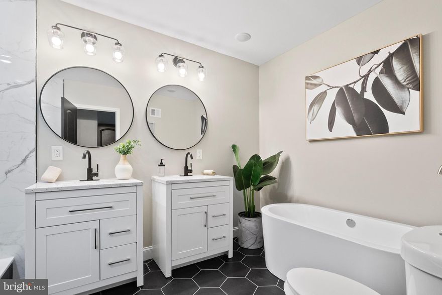 This home may qualify for Baltimore City Vacant to Value $10k grant program, Baltimore City Employee Homeownership $10K incentive and UMB employees could be eligible to receive up to $18,500 towards their down payment or closing cost. 

Welcome to your dream home! This meticulously crafted, 4-bedrooms, 4.5-baths gem offers over 3000 square feet of luxurious living space across four levels. As you step inside, you'll be greeted by an open and airy living area that seamlessly connects to the dining room and gourmet kitchen. The kitchen boasts high-end appliances, gas stove, granite countertops, and an island for casual dining. 

Luxury vinyl floors and large windows throughout the main level fill the space with natural light. The living room is perfect for cozy nights by the fireplace, while the dining area offers a convenient transition to the outdoor deck for al fresco dining and entertaining. 

On the 2nd level, you'll see two junior suite bedrooms with private ensuite bathrooms. Additionally, on this level, you'll have access to a hallway laundry hookup and ample closet space throughout. 

The third level is dedicated to your primary suite. The primary suite features a luxurious ensuite bathroom with a spa-like soaking tub, separate shower, and dual vanities. This level also has a home office/bonus room. 

The lower level of this home is an entertainer's paradise. It features a fully finished basement with a wet bar, creating the perfect spot for game nights, gatherings, or even a private retreat. A full bathroom on this level and a bedroom adds to the convenience and functionality of this space. With a little bit of creativity, the basement could easily be converted into an income suite. 

Conveniently located to downtown Baltimore Inner Harbor, loads of restaurants, shopping, and 1 block from Union Square Park and down the street from Bon Secour Hospital and the newest community park (Unity Park). Don't miss your chance to own this stunning 4-bedroom, 4.5-bath home with a finished basement with wet bar, home office, and beautiful outdoor space. Schedule your private showing today and experience the epitome of modern living.