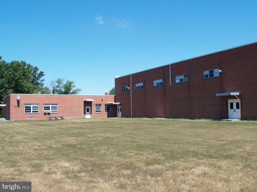 14.29 Acres - 23,057 SF Solid Brick/Concrete Block Building-  Formerly used as a private school - 9500 SF gymnasium with 22 ft ceilings, Kitchen, multiple classrooms and offices. 5 unit FHP GEOTHERMAL HVAC system. Zoned agricultural many "potential" uses - verify with County/Zoning. Easy drive to/from the Bay Bridge - about 30 minutes - 1/2  mile off Rte 301. No showings on Saturdays.