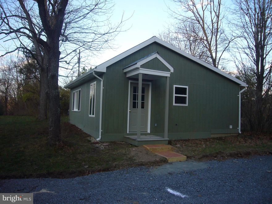 Quaint cabin in a peaceful setting on 2 lots for a total of 2.3 acres. Everything you need for a weekend getaway or full time living. New carpet and fresh paint. Full kitchen with all the appliances and space for a table. Even a nice size pantry.  Ceramic tiled bathroom with shower and included washer and dryer. Nice size living room with large picture window to help bring the outside in. Bedroom with ample closet space. Ceiling fans in living room and bedroom. Large garden space to grow your own vegetables. And a storage shed for lawn and gardening equipment. If you are looking for an affordable place to escape the hectic city life, you need to take a look at this property. Close to Berkeley Springs and all it has to offer.