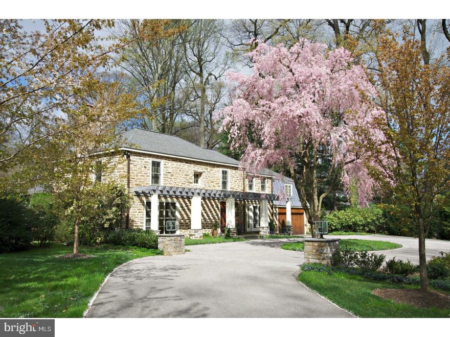 With a prevailing sense of graciousness throughout, this remarkable home is the essence of refined living with state of the art amenities and extraordinary architectural details. This one of a kind treasure has been completely renovated inside and out since purchased by the present owner. Set back from the street, you are welcomed to this wonderful stone home by a circular,lighted,cobbled edge and professionally landscaped guest parking courtyard. Through a stunning solid mahogany door you enter into a transverse center hall which is flanked by a handsome Study/Library with custom cabinetry, shelving and new double French doors to the front portico, an exquisite Living Room with fireplace and access to the Game/Pool Room. For intimate and grand entertaining the Dining Room is positioned in the heart of the home and opens to the amazing Family Room, the very spacious Kitchen and Breakfast Room and A Powder Room, The Laundry Room with wonderful details is accessed from the coat/mud room which opens to the Garage that features a new mahogany double door, epoxy floor covering, new lighting and a new work/storage Room. A classic turned staircase takes you to the 2nd floor which is highlighted by: the Master Suite with a walk-in closet/dressing room and a luxurious bath, 3 additional family Bedrooms and 2 full baths; the 4th Bedroom is a guest suite accessed from the back stairs. The Lower Level is enhanced by: awesome lighting and flooring, a mini Kitchen, a wine room and is plumbed for a full bath. This beautiful home is Ideally located in the estate area of northside Bryn Mawr, just minutes from highly respected schools and all that suburban Philadelphia has to offer.