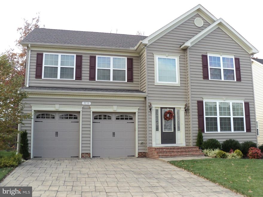 Stunning, 5BR, 3.5BA home w/approx 4300 sq. ft..  Shows like a model with tasteful custom paint and blinds throughout. Imagine cooking in your fabulous kitchen with granite counters, cherry cabinets, stainless appliances with double wall ovens and more.  Step out into your private screened-in porch with lovely wooded view. Enjoy your own media room and wet bar with rec room on lower level. GREAT!