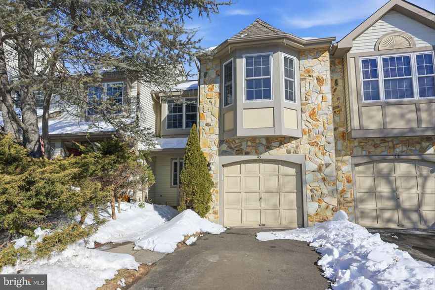 Located in the Willow Creek/Eagle Trace cluster in the sought-after Newtown Grant neighborhood, this townhome is located on a quiet cul-de-sac. Enter through the tiled foyer that opens to the living room and adjoining dining room. The light and bright living room boasts a cathedral ceiling with skylights. The living room, dining room and primary bedroom all have custom designer wainscoting and moldings. Entertaining will be easy with the dining room right next to the kitchen; sliding glass doors provide access from the dining room to the back yard with private patio, where you can relax in the warmer months.. The kitchen features quality, newer SS appliances. On the main floor you will also find a half bath, coat closet, laundry room, and interior access to the attached one car garage. Upstairs are three nice-sized bedrooms (one with floor-to-ceiling bookshelves) with ample closet space and two full baths.  Plus, enjoy all the amenities Newtown Grant offers, including two pools, tennis courts, pickleball courts, basketball courts, athletic field for softball and play area with a sand lot for the kids.  The clubhouse features a versatile, rentable banquet room with an adjoining kitchen. Inside the clubhouse, residents can access a game room with billiards, ping pong, darts, and foosball, along with a lending library.  All of this within close proximity to Newtown, where you will find shopping and restaurants galore, and in the award-winning Council Rock School District.   This townhome is being sold “as is” by the original owner, who purchased the developer's model unit for this section of Newtown Grant.  Bring your creativity, palette and design ideas to update this lovely home and make it your very own!  Schedule your appointment today!