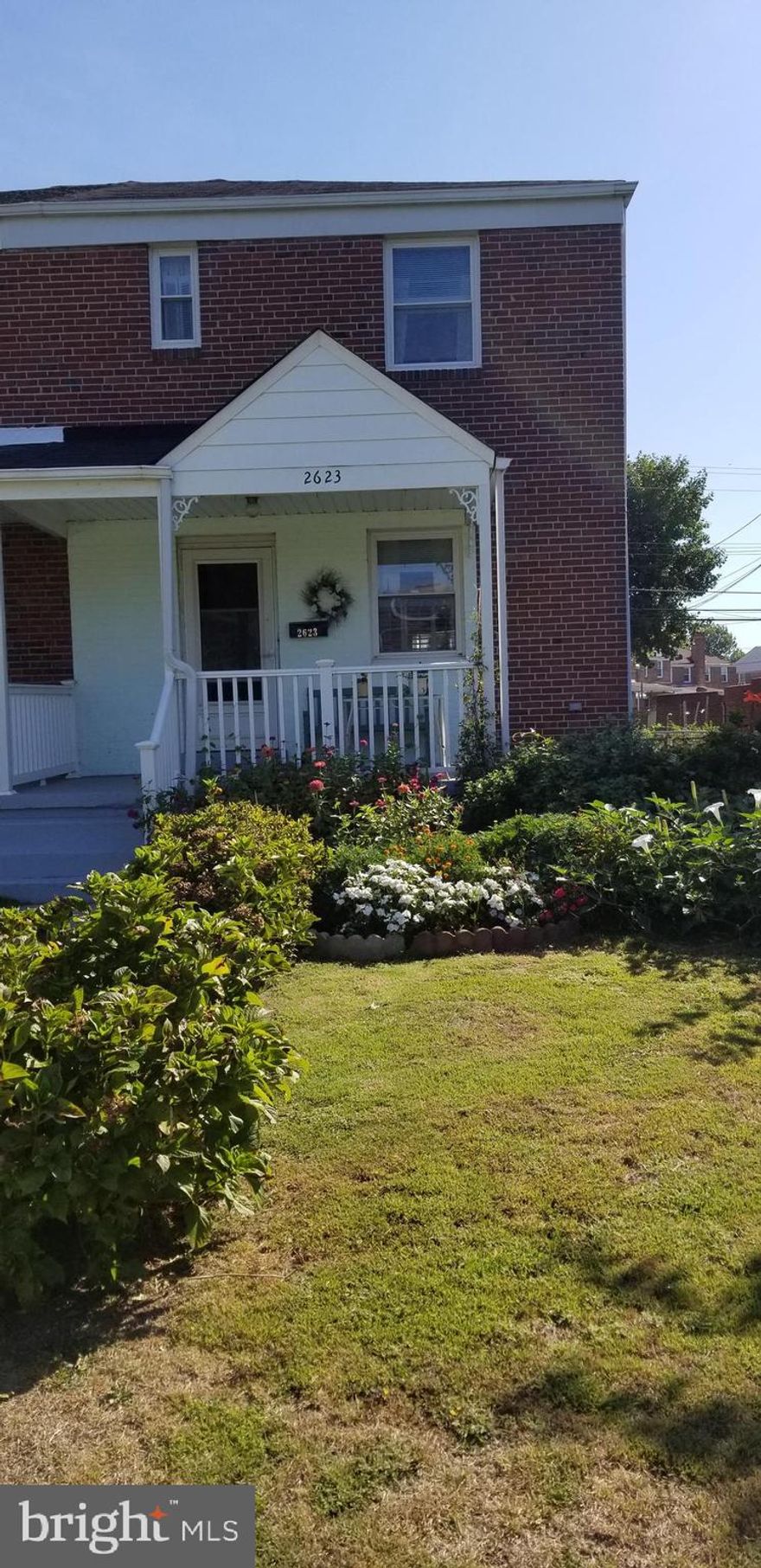 This lovely home is located in the heart of Dundalk.  Walking distance to public transportation, shopping, restaurants,churches and schools.  It is a SPACIOUS  duplex with many updates plus a fenced landscaped, brick back yard that cuts down on the mowing .  The detached one car garage with storage space plus a 1 car parking pad for parking convenience, is located steps way from your back door. The house was built as a 3 bedroom  home.  One wall was removed to make a larger main bedroom. It could be 3 again if needed. The sq ft is there. The second level updated bathroom has a Jacuzzi tub for relaxing  baths or quick showers. The bright kitchen would make any cook happy with a breakfast bar and stools plus shining hardwood floors in dining and living rooms. Two great rooms for family living.  The family room on the lower level has a full bathroom, laundry area and  room for storage and an outside entrance.  Central air, gas furnace, gas hot water heater, ROOF, washer, dryer and refrigerator are less then 10yrs old. Oh and the dishwasher is new. Make an appointment quickly to see the awesome home and make it yours.