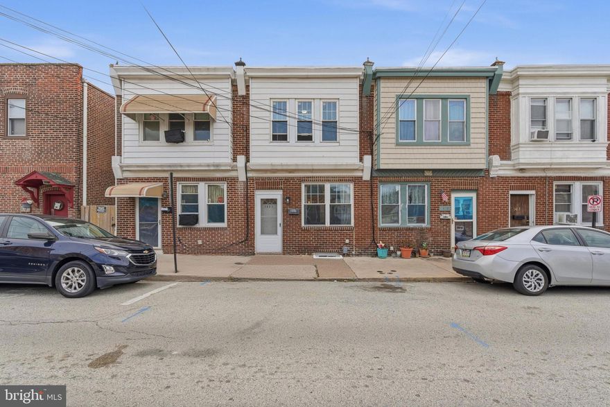 Welcome to 1421 E 11th Street in Eddystone! This spacious and updated rowhome is larger than the typical interior home on the block and offers modern upgrades throughout. The first floor features a bright living room with newer carpet, a large front window, and an open flow into the dining area—perfect for gatherings or flexible use of space. The updated kitchen includes white cabinetry, stainless steel appliances, gas cooking, tile flooring, and a stylish backsplash. A bonus area off the kitchen provides added versatility for storage, a breakfast nook, or a mudroom space. Upstairs offers comfortable bedrooms with newer carpeting and updated bath spaces. The home is equipped with newer central heating and air, gas utilities, and major improvements including a new roof, new skylights, and a french drain system for added peace of mind. The basement provides excellent storage potential. Conveniently located near local shops, public transportation, and major roadways.