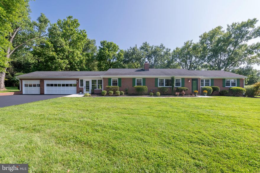 Welcome to this stunning 4-bedroom rancher, with large finished basement, located in the prestigious highly sought-after community of Windemere.  Nestled on a 1.49 acre double lot, this home offers the perfect blend of indoor and outdoor living.  Step inside and be prepared to be impressed by the exquisite craftmanship and custom moldings throughout this home!  The main level’s highlights include hardwood flooring, recessed lighting, updated bathrooms, an updated eat-in kitchen with an island breakfast bar, and a beautiful brick wood-burning fireplace with mantel.   You will also enjoy the abundance of natural light that fills the living areas on this level.  To get to the lower level, go down the custom-built wood stairway where you will find high ceilings and walk-out stairs creating an inviting space.  The generously sized family room features a brick, wood burning stove.  A storage room with built-in shelving provides convenient options for organization.  Additionally, there are three rooms, one of which includes a rough-in for a bathroom, allowing you to personalize the space to your liking.  The exterior of this property is a true gem in a picturesque park-like setting.  With a patio and perfectly level yard, there’s plenty of room for relaxation, entertaining and even a game of your favorite sport.  A brick adorned breezeway, featuring built-in shelving and a rustic farm door, connects the home to a three-car garage, adding both convenience and functionality.  This prime location offers easy access to major routes, the scenic Loch Raven Reservoir, and a variety of shopping and dining options.  Don’t miss the chance to own this truly unique property!