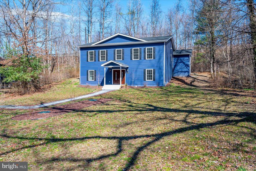 This home offers a flexible layout paired with contemporary finishes. The entry level features a half bath and laundry area. Upstairs, the kitchen with stainless steel appliances opens to the dining and living areas, creating an easy flow for everyday living and entertaining. The upper level includes four rooms currently used as bedrooms, two full baths (one being a primary bedroom ensuite), and a desk nook. The primary suite offers a generous closet and ensuite bath.

Additional features include updated siding, roof, a detached garage and a newly added partial privacy fence. The Property is serviced by holding tanks. Conveniently located near Bacon Ridge Natural Area and downtown Annapolis, with easy access to shopping and major commuter routes.