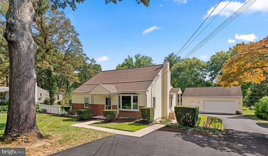 Welcome to this charming cape cod conveniently located within walking distance to Anne Arundel County's Kinder Farm and Elvaton Parks, and also being in close proximity to the B&A Trail. You'll immediately appreciate the pride of ownership in this wonderfully maintained 3 bedroom home on a beautifully landscaped half acre lot with mature trees and seasonal plants offering a perfect space for outdoor enjoyment. Main level kitchen, dining room, and family room along with 2 bedrooms with hardwood floors, and a full bath. Gorgeous hardwood floors can also be found under the family room carpeting. Kitchen is bright and sun-filled offering ample cabinet and counter space, and a KitchenAid gas range. Travel to the upper level where you'll find an additional bedroom, half bathroom and a great bonus area offering built-in shelving & loads of storage space. Pella windows & doors with architectural design and function. New roof installed in 2019. Lower-level cellar has partial finishes with a newer washing machine and dryer, built-in shelving, a workbench & steps to the rear yard. Enjoy the detached garage that can accommodate 3 cars, has ample space for workbenches and equipment, and includes rafter storage. A spacious paved driveway extending to the back of the home & an additional storage shed in the rear of the yard. This convenient location offers commuter access and is close to shopping & other amenities. Under 15 miles to Annapolis, under 20 miles to Baltimore, and under 40 miles to Washington DC. Schedule your private tour today!