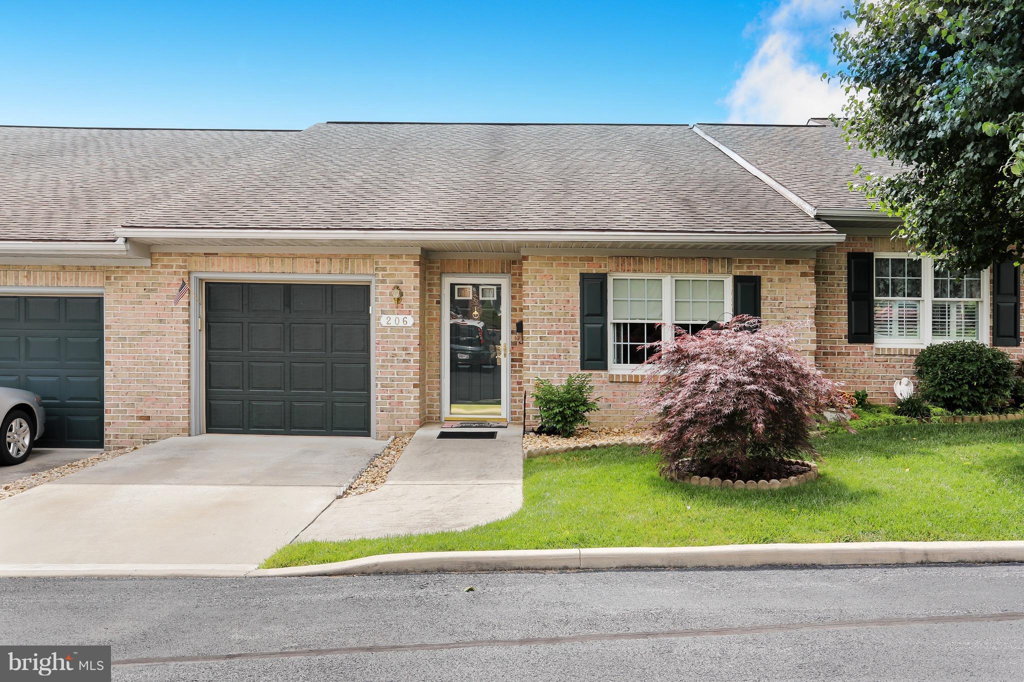 This brick townhome has it all. New floors, painted throughout, new counters in kitchen, water heater, lights, epoxy in garage, mirrors and light fixtures, storm doors, and the list goes on and on. Sunroom is bright and provides additional living space. Nothing to do but move in. Make sure you check this unit out first! Plenty of parking for your guest and the community building is close by.