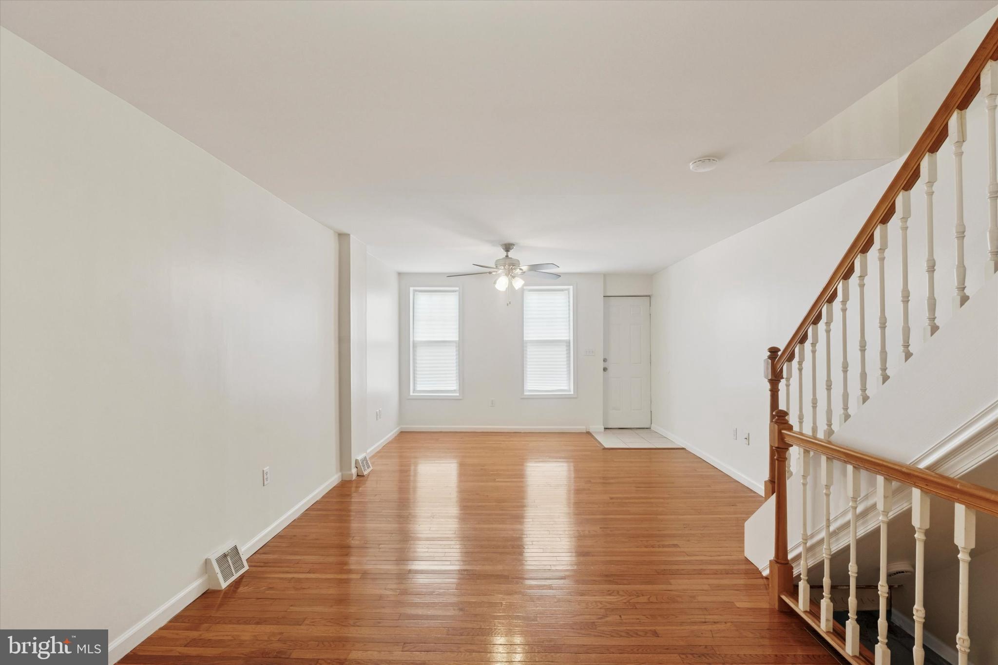 Yes, you can still afford to buy in Pennsport, and no, that doesn’t mean you have to live in a “grandma house”–this cute rowhome with a budget-friendly price is in absolutely move-in condition. Its neutral palette and finishes provide a great base for you to make it your own, whether your style is traditional, modern or something in between. The open-plan first floor has newer oak floors in the main living space, which gets great light from the two south-facing front windows. The ceramic tile rear kitchen with a nice picture window has a stainless steel fridge and five-burner range in an efficient layout that provides good storage space via wood cabinets without sacrificing the all-important dishwasher. The paved rear yard is L-shaped, meaning you can stash a grill and trash cans around the side–or add an AC condenser down the road–with plenty of room left for seating. There’s also access to a shared breezeway to the street, which is great for bikes and trash day. Both sunny upstairs bedrooms have newly installed carpet and good-sized closets. The hall bath has ceramic tile flooring, a generous vanity and a rear-facing window. The spacious basement offers laundry and storage. This great Pennsport side block around the corner from EOM Athletic Association is as walkable to neighborhood faves like Moonshine, Rebel & Wolf coffee and Dickinson Square Park as it is convenient to big-box shopping and I-95. This rare opportunity is truly a no-brainer for anyone paying market-rate rent.