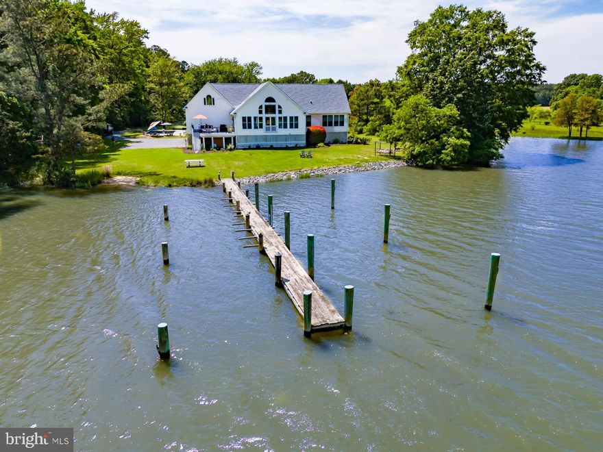 Welcome to this stunning 4BR/2BA coastal traditional-style  home, perfectly sited on 3.008 acres with breathtaking views of Irish Creek. Built in 2007, this charming residence offers 2,275 square feet of elegant living space designed to capture the essence of waterfront living. Step inside to discover beautiful hardwood flooring and cathedral ceilings that enhance the home's airy and open ambiance. The centerpiece of the living area is a gorgeous floor-to-ceiling arched window, perfectly framing the serene water views and flooding the interior space with natural light. The open floor plan seamlessly connects the spacious living room, dining area, and gourmet kitchen, creating an inviting space for both everyday living and entertaining. The  primary suite is a true retreat with  panoramic water views, and includes a completely renovated  luxurious ensuite bath featuring a glass-enclosed shower,  soaking tub, and double sink vanity. Each of the additional three bedrooms (one currently being used as an office) is comfortably sized, ensuring comfort and privacy for family and guests alike. Outdoor living is just as impressive, with an elevated waterside deck, sparkling in-ground pool completed in 2023, kayak launch, and private dock equipped with two slips and 3' MLW, perfect for water enthusiasts. Enjoy sunrises over the water, or take advantage of the ample space for outdoor gatherings and activities. This exceptional property offers the perfect blend of luxury and tranquility, making it an ideal home for those seeking a serene waterfront lifestyle on the Eastern Shore.