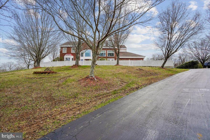 OPEN SUN 3/22, 1-3PM! 

A STUNNING  SHOWCASE IN ESWORTHY PARK!

UNPARALLELED charm defines this former builder’s model home offering 6,500+ sq ft of bright living space on 2 private acres, perfect for year-round entertaining. This stunning 4-bedroom, 5-full-bath residence blends contemporary design with timeless elegance and features extensive hardscaping and numerous upgrades.

A white picket fence encircles this charming home on a hill. The brick walkway leads to a dramatic two-story foyer with Palladian windows, circular staircase, and gleaming hardwood floors. The spectacular, light-filled Great Room features cathedral ceilings, skylights, a wall of windows, stone fireplace with elevated stone hearth, and a wet bar. Across the hall, a private office with French doors provides an ideal workspace and cozy living room next door with a wall of windows and side door to the back yard and deck. The main level also features a full bath with a stall shower, offering the flexibility to convert the office into a first-floor bedroom. The formal dining room opens to the Trex deck and flagstone patio, creating seamless indoor-outdoor entertaining.  The oversized gourmet kitchen features stainless steel appliances, double wall-ovens, and ample room to prep meals. A cozy window ledge in the breakfast nook which overlooks the backyard is perfect for bird watching. Completing the main level- a large laundry room with sink and cabinetry, access to the two-car garage with checker-pattern flooring, and a side entrance to a spacious driveway accommodating four or more vehicles.

The owner’s suite is a true sanctuary with a wall of windows, two oversized walk-in closets, a dressing table, and an additional vanity. The luxuriously remodeled primary bath features a jetted soaking tub, large glass shower, custom tilework, dual marble-top vanities, skylights, and a separate water closet. Second bedroom with hardwood floors features ensuite bath and third and fourth bedroom share a private hallway with enclosed bathroom. 

The finished basement is ideal for family movie nights, featuring a projector wall with cinema lighting, recessed lighting, a bonus room with tile flooring and extra storage, and a second bonus room with a full bathroom. Additional storage includes extra closets and under-stair space.

Over $110,000 in updates include: remodeled primary bath (2010), powder room converted to full bath (2014), upper-level hardwood flooring and painting (2024), roof (2015), HVAC (2017), hot water heater (2024), composite deck (2024), and front brick patio with white picket fence (2022). Additionally, most windows have been replaced within the past 10–12 years.

 All of this in the idyllic charm of countryside Potomac but only minutes from Bretton Woods, Potomac Village, Kentlands, Darnestown and more.   ***Offers are due by 10:00am on Wednesday 3/25***