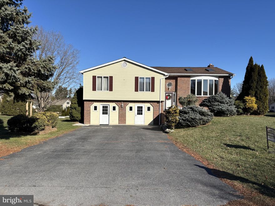 Spacious home with so much to offer.  Four bedrooms upper level with two full bathroom and one-bedroom lower level with one full & one-half bath (Easily can be made into a seven-bedroom home).  Two kitchens with appliances as shown, over/under beautiful sunrooms with plenty of natural light, two bottled gas fireplaces, skylights, spacious living room, and dining area. Large patio and rear deck for entertaining, fenced rear yard, sheds and mature landscaping. Do not miss this home! Schedule your showing today!