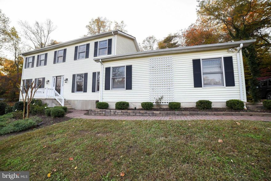 Warm & inviting Colonial home w/ numerous upgrades:Custom Kitchen w /granite counters,stainless appl's, 5-burner gas cooktop, wall oven. Gleaming hardwood floors,remodeled baths w/marble & Travertine, custom MBR closet!  FR w/FP; sep LR & DR; large BRs. Finished bsmnt has rec room w/gas FP, den, storage/wrkshp. Gunite IN-GROUND POOL w/patio surround & fence, screened porch, private lot.Deck & more