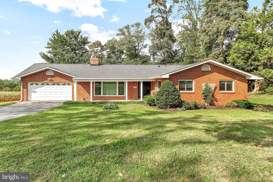 Move in ready!!      4 bed 2 bath brick rancher located on lovely level lot with scenic view of farmland.  New roof, wood and laminate flooring thruout.  Updated baths, stainless appliances.  Large deck, 2 car attached garage, wood stove in the livingroom.  Lots to offer.  You will not be disappointed.