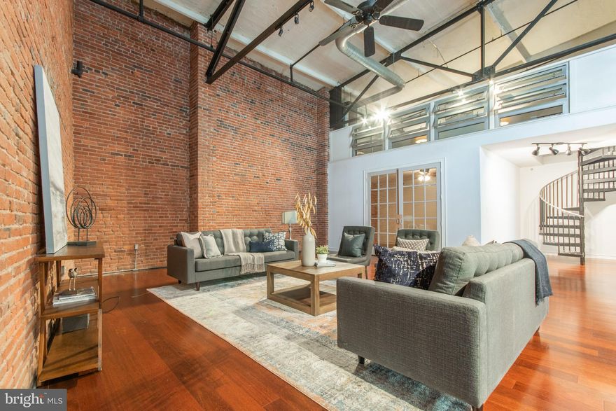Huge New York style loft in Northern Liberties with 3 car parking! 3 bedrooms, 2 bathrooms. This loft features a den that can easily be used as a 3rd bedroom. 18-foot ceilings. Exposed brick. Hardwood flooring throughout main living space and carpet in bedrooms. Washer and dryer in unit.  The kitchen features wood cabinets,  granite countertops, stainless steel appliances, and a large island perfect for entertaining.  Also includes a wine fridge. Private outdoor deck off kitchen! Garage parking conveniently located right outside back door. Walker's paradise — this condo has a 94 walk score — located near a variety of amazing restaurants, shops, and grocery stores.