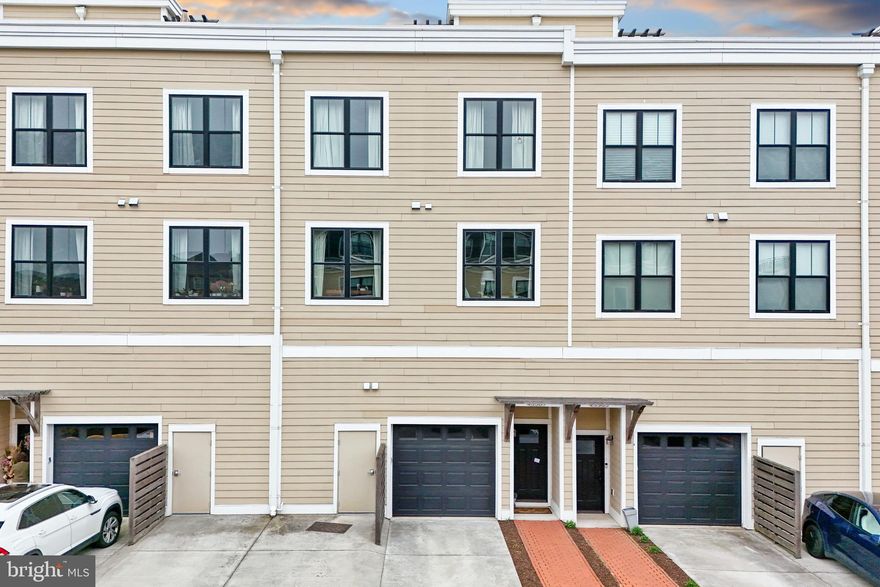 RARELY AVAILABLE Urban-Styled Townhome/Condo at Lansdowne Town Center!  Home offers an EXCEPTIONAL floor plan with 9" ceilings throughout. Parking is a breeze with 1-car garage + Driveway space + parking area for visitors!   MAIN LEVEL includes stunning Island Kitchen with breakfast bar + breakfast table area and large open concept Family Room.   Formal Dining Room + Formal Living Room  + Office w/french doors - great for working from home!   BEDROOM LEVEL features a lovely Owner's suite with sitting room + private balcony.  You will also love the lux bathroom and walk in closet!  Secondary bedrooms each have walk-in closets and a large modern hall bath with dual vanity.  You will also find a bedroom level laundry room with a Bosch Washer/Dryer.   Check out the ROOFTOP deck with stunning views to enjoy a sundown cocktail, seasonal fireworks, or cookout with ease with the Gas Grill Hookup!  Enjoy all that Lansdowne Town Center has to offer - Walk to Shops, Restaurants, Grocery, Salon services, Pet care shops + vet, and so much more!  The Town Center also has a wonderful courtyard lawn with a summer concert series, seasonal events, and can be enjoyed throughout the year.  Please note: Association fees INCLUDE Comcast Internet / Cable + Fitness / Swimming Pool.