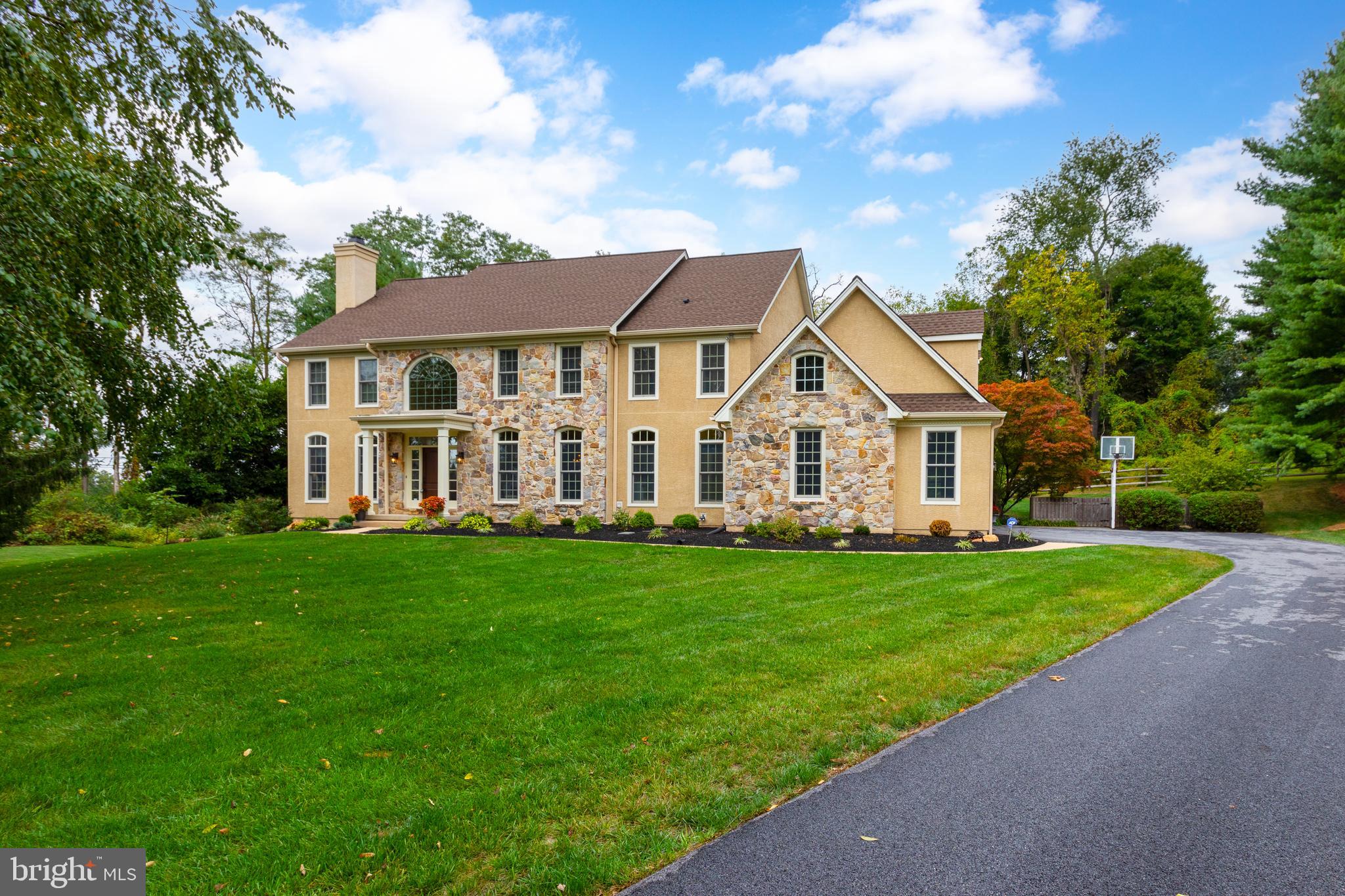 Welcome to this stunning estate home in Birmingham Township, where luxury meets meticulous care. As you approach, you’ll immediately notice the pristine condition of this residence, featuring complete stucco remediation, ensuring not just beauty but also durability. The entire exterior is now maintenance-free! With all windows and the roof replaced in 2016, new garage doors in 2024, and driveway replacement in 2021, it feels like a brand-new home. Upon entering, you’re greeted by light hardwood floors (installed in 2023) throughout most of the main level. To the left, you'll find a charming living room with custom built-ins and a cozy gas fireplace. On the right, the formal dining room sets the stage for memorable holiday gatherings. The family room is a true entertainer's paradise, boasting a floor-to-ceiling stone wood-burning fireplace and a convenient mini-bar. The home office, featuring large windows with views of the private backyard, offers a serene workspace. The heart of this home is the chef’s dream kitchen, completely renovated in 2023. It features a professional six-burner range, a stylish coffee bar, and a large island with elegant quartz countertops. The blend of white upper cabinets and natural wood lower cabinets exudes sophistication. A butler’s pantry, laundry room, and two powder rooms complete the first floor. Upstairs, the primary retreat is a true sanctuary, offering a gas fireplace, vaulted ceilings, and a spacious sitting area (currently used as a second office). The primary bathroom is a showstopper with a freestanding tub, a luxurious large shower with beautiful tile, a separate water closet, and a double sink vanity. Two expansive walk-in closets and a dressing area complete this serene space. Two additional bedrooms share a full bath (updated in 2021), and the fourth bedroom, expanded in 2016, is perfect for guests or an au pair, with its own updated full bath and ample closet space. The finished lower level offers even more living space, with a private room, a TV area, a workshop, a storage area, and an additional full bathroom complete with a sauna. The walkout basement leads to the peaceful side yard. Outside, the large patio overlooks a private backyard, offering a tranquil retreat and the perfect setting for relaxation or outdoor entertaining. This home, with all its thoughtful updates and pristine condition, is a rare gem in Birmingham Township. It truly feels like a new home, offering timeless elegance, modern conveniences, and a private, serene setting.