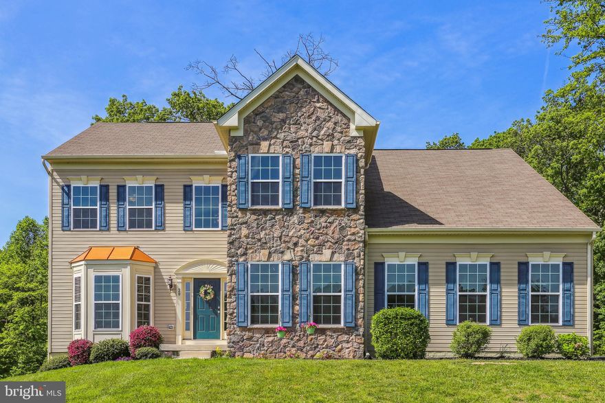 A stately home in the desirable Rhodes Mountain Estates community. 5 Bedroom Home with 3.5 Baths and well over 4,500 sqft.  Exceptionally maintained featuring a gourmet kitchen opening to a morning room and large family room. The spacious Master Suite with vaulted ceiling has a spa-like Master Bath with a separate shower enclosure. The basement is fully finished with a walkout. This stunning residence backs up to a secluded Forest Conservation area setting.  Dual Zone HVAC, Community Propane, 2-car side load Garage, Generator hookup, and so much more.