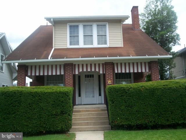 downstairs are living & dining rooms, kitchen, enclosed sun room, office and half bath, upstairs are 3 bedrooms, full bath and laundry (washer/dryer stays); walk in pantry off of the kitchen, extra storage off sunroom; all windows are replacement windows