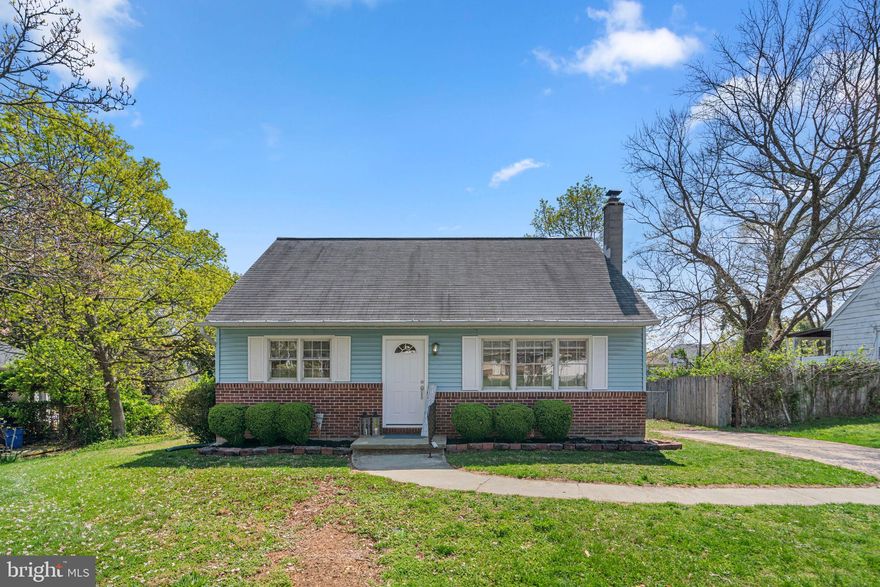 Charming brick-accented Cape Cod-style residence offering 1,537 square feet, 4 bedrooms, and 2 full baths, nestled in picturesque Ellicott City. Hardwood floors flow throughout the traditional main-level layout. Step into the spacious, sun-filled living room, ideal for relaxing or entertaining. The bright and open eat-in kitchen features upgraded countertops, stainless steel appliances, a gas range, sleek tile backsplash, ample white cabinetry, a breakfast area, and a pass-through window that overlooks the sunroom. The sunroom boasts vaulted ceilings and provides exterior access, perfect for enjoying natural light year-round. Two bedrooms and a full bathroom complete the main level. Upstairs, you'll find a full bathroom and two additional bedrooms with vaulted ceilings and laminate flooring, including the primary suite. The lower level offers a cozy recreation room with a brick-accented wood stove, walk-up access to the yard, and a laundry area. Recent improvements include a modern HVAC system, an updated garage door, and two replaced exterior doors at the front and back of the home. Outside, a refreshed deck overlooks the fenced yard, while a large detached garage/outbuilding provides workshop space and a bar area—ideal for hobbies, gatherings, or additional storage.