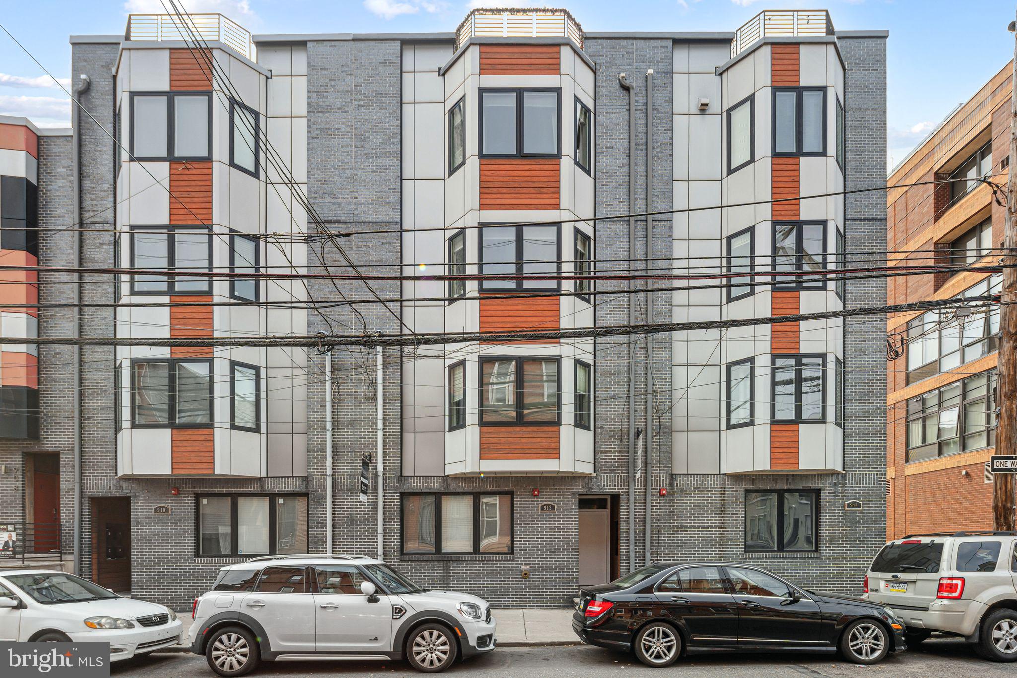 Welcome to **912 N 16th St #A**, a stunning condominium residence within the sophisticated *Francisville Quarters* development. Nestled in a vibrant and rapidly growing neighborhood, this thoughtfully designed home offers 1,650 square feet of living space along with 525 square feet of outdoor space, perfect for entertaining or relaxing. The main level boasts an open-concept living, dining, and kitchen area with luxurious finishes like Aster kitchen cabinets, quartz countertops, and premium oak hardwood floors. The spacious master suite features a **MASSIVE walk-in closet**, providing ample storage. Downstairs, the lower level offers a central recreation space, along with two additional bedrooms, each with its own private full bath.
This home includes rare features like basement storage units and bike storage, and is equipped with Andersen Windows, Grohe plumbing fixtures, and Samsung stainless steel appliances, ensuring comfort and style. Located just steps from the bustling shops and cafes on Ridge Avenue, and near historic landmarks like the Divine Lorraine Hotel and Metropolitan Opera House, **Francisville Quarters** offers the perfect blend of urban convenience and modern luxury living. Home has approx 4 year left on tax abatement. Don’t miss this opportunity to make this incredible space your own!
