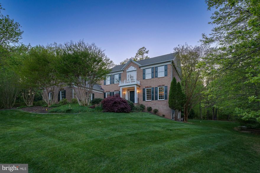 Gorgeous colonial home located in the highly desirable neighborhood of Dartmoor Woods, 3 car garage, and driveway sited on a .66 acre lot backing to acres of parkland. This home features 5 bedrooms, 4.5 bathrooms and 5,732 square feet over 3 levels.  Attention to detail throughout the main level with crown molding, chair railing, hardwood floors, hardwood floors, and recess lighting. Welcoming foyer that leads to formal living room, dining room, and office. Spacious gourmet kitchen with stainless steel appliances, built-in microwave, double oven, granite countertops, cooktop, and center island with bar seating. Large breakfast room has easy access to the deck. Inviting family room with fireplace and stairway to the upper level. Main level also features office with built-in bookshelves, laundry room, and half bath. Owner's suite features an elaborate library/sitting room, with a fireplace, built-in bookshelves,  walk-in closet, and en suite bathroom with dual vanities, walk-in glass shower and jetted tub.  Three additional bedrooms, en suite bathroom, and full bathroom on the upper level. Huge finished walk-out above ground basement on two sides with plentiful windows allowing for natural light on. Tons of potential in the large recreation room, bedroom, and full bath. Unwind outside on the deck with built-in bench seating and a well maintained back yard that backs to 28-acre forest park with privacy in back. This great location offers convenient access to both shopping, restaurants, and major roadways. Nearby Waples Mill, Franklin and Oakton Pyramid.