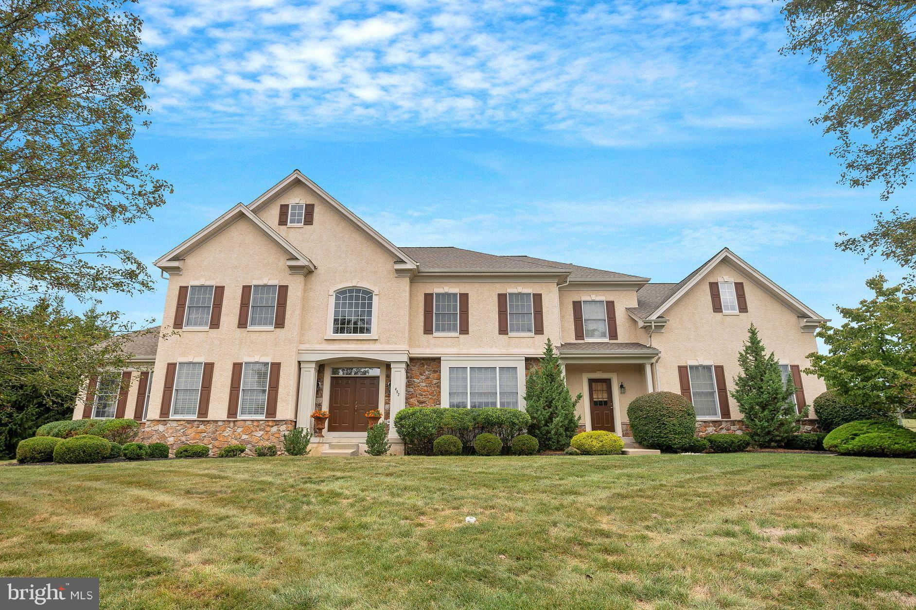 Welcome to your dream home in the sought after Highgate Community in Ambler/Horsham. This exquisite residence features two covered front entrances, leading you into a gracious foyer adorned with stunning woodwork and a beautifully crafted turned staircase. Enjoy gatherings in the sophisticated living and dining rooms, each showcasing elegant woodwork and ample natural light. The first-floor conservatory is filled with windows that invite the outside in, perfect for entertaining and relaxing. A dedicated office space with a triple window and two work areas ensures productivity while enjoying serene views. The expansive family room boasts soaring ceilings, a cozy gas fireplace, wet bar, and abundant windows, creating a warm and inviting atmosphere. Entertain effortlessly in the gourmet kitchen, which features an island with a prep sink and dedicated seating, stainless steel appliances including double ovens, gas cooking, and a Sub-Zero fridge/freezer, as well as a built-in desk area and pantry closet. The breakfast room accommodates a large table, complete with a window seat and patio access. A convenient mudroom/laundry with a custom coat closet and access to the three-car attached garage adds both practicality and style, while a powder room completes the first floor. As you ascend to the second floor, (using the front or back staircase) you'll find a Juliet balcony overlooking the family room and four well-appointed bedrooms. The magnificent primary suite includes three walk-in closets and a cozy sitting room, along with a luxurious primary bath featuring double sinks, a soaking tub, and an oversized stall shower. The second bedroom has its own en suite bath, while bedrooms three and four share a well-designed Jack & Jill bath, with all bedrooms featuring custom closets. You The professionally finished basement is an entertainer's dream, offering an au pair suite, a full gym for your fitness needs, and a family room with a kitchenette equipped with two refrigerator drawers, a microwave, warming drawer, dishwasher and granite countertops. The theater/media room provides an immersive experience with seven theater chairs and additional seating for four at an island/bar, while the game room area features sliding doors leading to the outdoors. The outside entertaining space features a stunning three-level patio overlooking a meticulously manicured lawn, ideal for barbeques or peaceful evenings. The spacious driveway provides ample off-street parking. Newer roof (2022) , hot water heaters (2022 & 2023) and newer A/C (2022 & 2023). This home is located near schools, library, multiple parks and preserved land for walking, running, and hiking, and you’ll have your pick of multiple shopping areas, popular grocery stores, fantastic dining experiences, award-winning golf courses, major roadways, and quick access to several rail commuting options. HURRY!