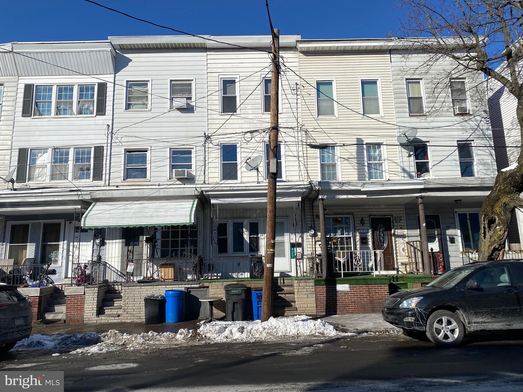 ***Attention Investors*** Lots of potential in this 5 bedroom townhouse. New windows throughout.. 3 story garage in back that can easily be turned into a 2 bedroom unit. Selling as-is.
