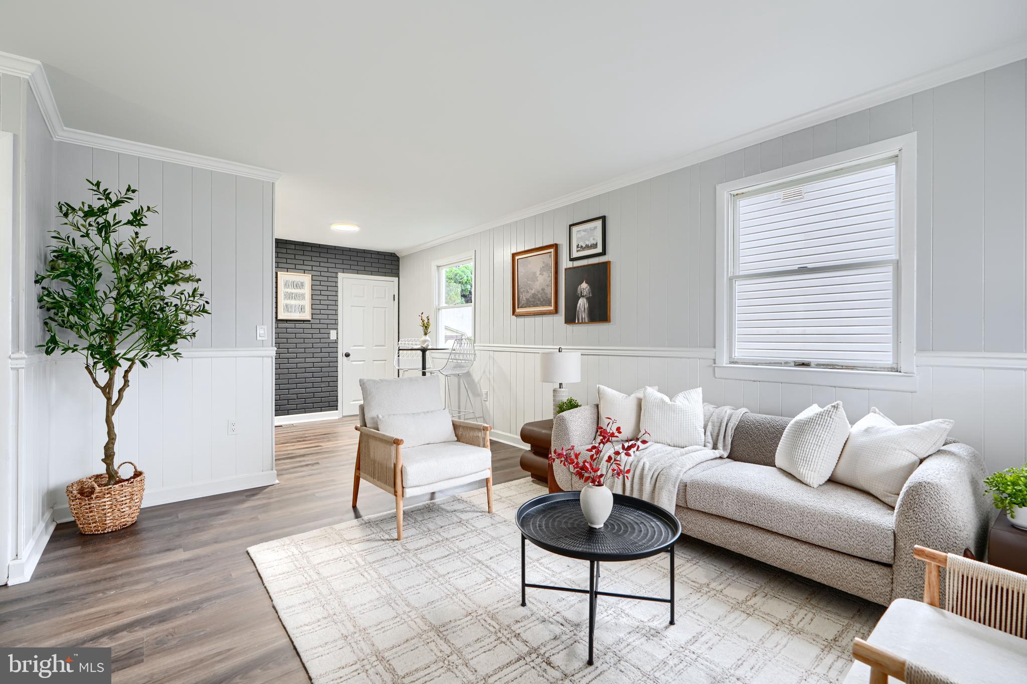 Come have a look at this charming, tastefully renovated 4BR/2BA home that includes private parking, fully remodeled basement, and all of the modern amenities. As you step into the LR from the covered front porch, you will notice the classic and freshly painted wainscoting that adorns the living space. There are three amply sized bedrooms at this level , each with closet and natural light. New luxury vinyl plank flooring has been installed throughout the main level. The updated full bathroom offers a shower/tub combo with tile surround and a convenient linen closet. The brand new kitchen includes all new stainless steel appliances, white shaker cabinetry with new hardware and new countertops. There is a textured accent wall offering a lovely contrast between the main level and the completely reimagined basement space. The basement offers an all new bathroom, the fourth bedroom, as well as additional flex/family room space. This newly finished space has been waterproofed with a french drain system and two sump pumps. The second full bathroom with standing shower offers a dazzling custom tile surround and a convenient stackable washer/dryer. The lower level includes new recessed lighting and luxury vinyl plank flooring. The HVAC systems (furnace and exterior condenser) are brand new to keep you comfortable for years to come. Meander to the rear exterior of the property to find a fully fenced rear yard, an attached screened-in porch, and a large storage/tool shed. The concrete driveway offers plenty of space for 4+ vehicles and includes a canopy structure to keep a vehicle covered from the elements. This home has been entirely repainted, includes a brand new water heater, and much more! This incredible property has been meticulously upgraded and is conveniently located near major transportation routes, UMBC, and south Baltimore. Come have a look before it's gone.