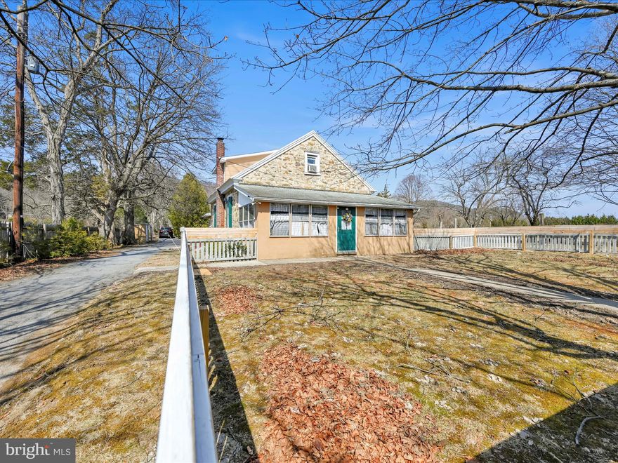Step into history with this one-of-a-kind home in Auburn, originally built in 1878 as a one-room schoolhouse. The Mengel School House was decommissioned in 1943 and converted into a residence in 1947, this cherished property has been in the same family for 78 years. This solid home has 30-inch stone walls and beautiful original windows on the lower level, offering a glimpse into its storied past. The second floor was later added and just recently finished into living space. The layout includes three upstairs bedrooms, two full baths (one on each floor), and a spacious laundry/mudroom at the rear of the home. New furnace installed in October. Enjoy relaxing on the enclosed front porch, perfect for unwinding after a long day with a fenced in front yard perfect for the kids or pets. Outside, the property offers plenty of space and functionality, featuring a large shed with a wooden deck, a dog kennel with an additional shed, and a two-story workshop with two-bay garage providing ample storage and workspace . The through-driveway offers access from both Route 895 and Fort Lebanon Road which is very convenient. Additionally, this property also includes the parcel across the street which makes the total acreage 3. 4 acres. Mature beautiful landscaping will amaze in the Spring along the driveway and all over the property. While the home could use some repairs and updates, it presents endless potential for those looking to restore and personalize a piece of local history. Don’t miss this rare opportunity to own a unique, character-filled home! Schedule your private showing today!