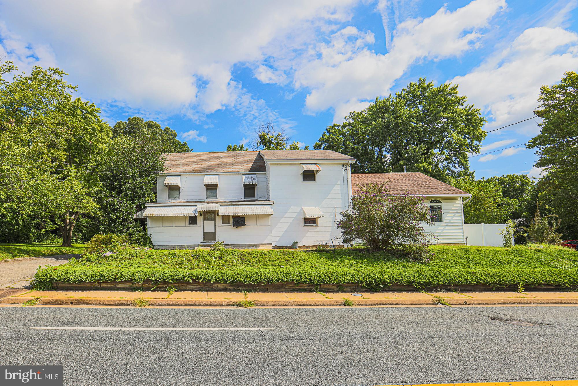 IMPROVED PRICE**LARGER HOME IN PRIVATE SETTING ** Embrace the charm of living amidst renovation! This historic Perry Hall landmark offers a prime location, just steps away from shopping and restaurants. With its unique layout spanning two separate living spaces, this multi-family residence can be customized to suit your preferences. The main residence boasts a generously-sized additional room added in 2001 and a kitchen renovated in 2005. The upstairs residence has its own private entrance, making it perfect for extended family It's time to get hands-on and craft the perfect home to fulfill your dreams. The shed on the left is actually a workshop with electric, the one on the right can be used for storage/lawn equipment, etc.