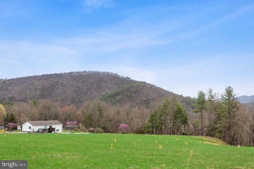 SHOWN BY APPOINTMENT ONLY - NO DRIVE-BYS! Amazing 17-acre hilltop setting in northwest Rockingham County, screaming peaceand tranquility along with wonderful panoramic views! Plenty of open fields for horses and other livestock while also home to lots of wildlife! Step inside this charming custom built modular home from PA with 3 bedrooms, 2 baths on the main level and an In-Law Quarters located on the lower level with private access. The main level offers the living room with vaulted ceiling and beautiful stone woodburning fireplace, warm kitchen with breakfast islandand pantry. The owner’s suite is spacious with walk-in closet, full bath with garden tub, shower and large vanity with 2 sinks. Step out onto the rear deck and enjoy the quiet open setting! The front deck also over looks a serene setting. Lots of opportunities to make this property your own with a hunting cabin or possible AirBnB; Barn/Workshop/Garage; detached camper and trailer for extra storage. Near the George Washington National Forest, deeded access to the North Fork of the Shenandoah River, within 15 miles of Broadway, within 2.5 hours of major airports. Must be pre-approved before viewing.