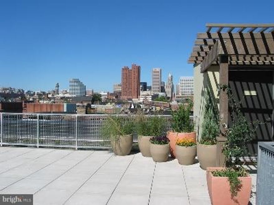 Contemporary 1 BR/1BA unit just a block away from renovated Cross St Market. 1 Garage parking space included! Unit finishes include granite counters, stainless appliances, and spacious balcony overlooking private courtyard. Building amenities include modern fitness center, indoor basketball court, common lounge area and roof top deck with downtown city skyline views. Tenant occupied.