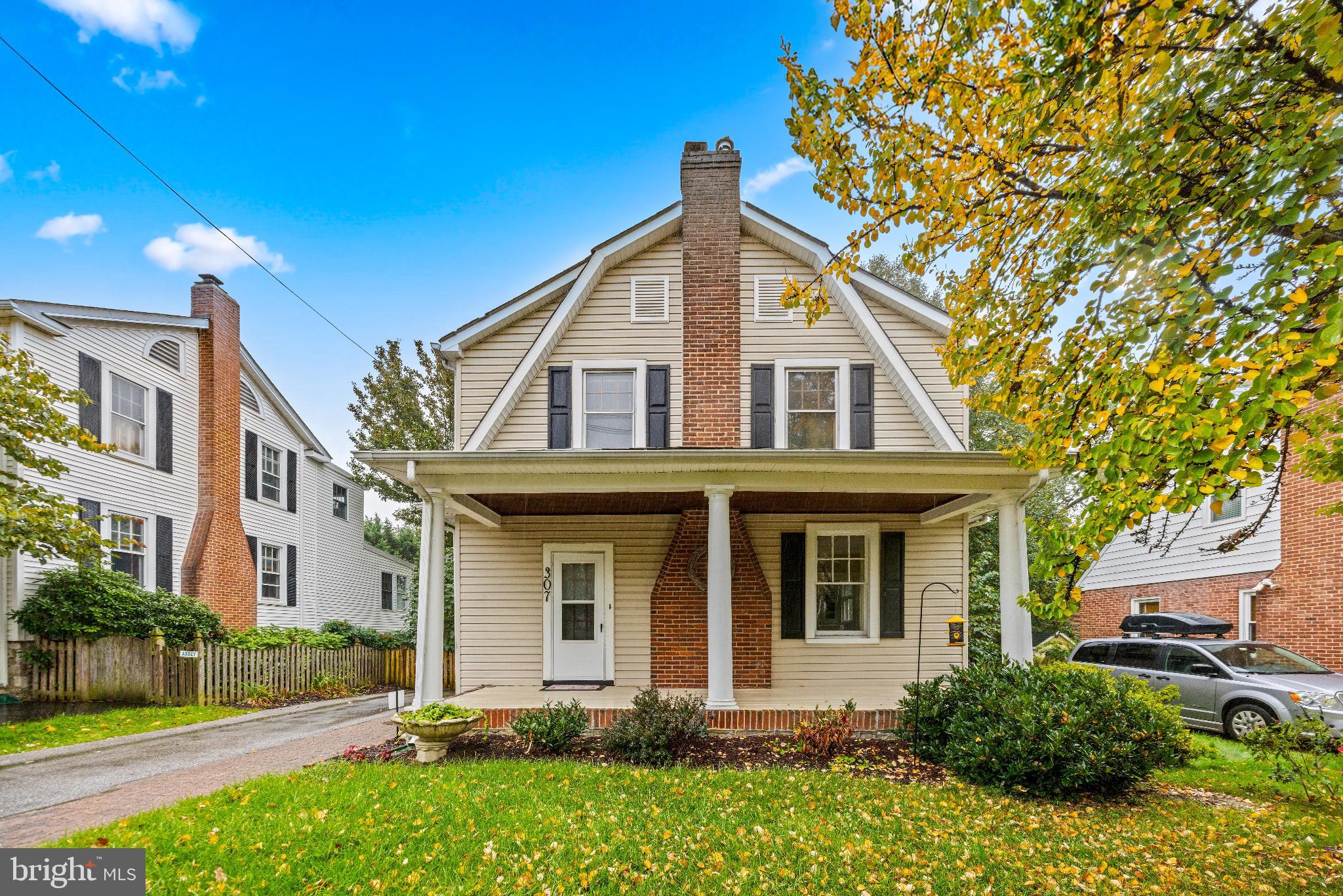Welcome to 307 E Lake Avenue, located in the highly sought-after community of Historic Cedarcroft! This 4-bedroom, 2-bathroom home, built in 1926, perfectly blends timeless charm with thoughtful modern updates. As you approach, the covered front porch immediately invites you to enjoy a morning coffee or unwind in the evening. Inside, gorgeous hardwood floors complement a traditional layout featuring a spacious living room, dining area, kitchen, mudroom, a versatile bedroom or office, and a full bathroom. The kitchen has been beautifully updated with soft-close cabinetry, stone countertops, stainless steel appliances, and a stylish tile backsplash. A cedar pantry adjacent to the breakfast nook provides additional storage and leads to a large covered and screened back deck. This 3-season room is a true oasis and is sure to become a favorite space in the home. From here, step down to the flat, fenced backyard featuring flowering plants and a fig tree during warmer months. A potential butler’s pantry offers convenient storage between the kitchen and living area, while a bonus room on the main level can serve as a fourth bedroom or additional living space conveniently located next to the full bathroom. Upstairs, you’ll find three generously sized bedrooms, including an oversized primary suite. There is a full bathroom, an additional walk-in closet, and a bonus room off one of the bedrooms. Natural light fills every room, and storage is abundant throughout the home including a walk-up attic and unfinished basement. Additional features include a 2-car garage and ample parking. Recent updates include fresh paint (2025), new garage door (2025), basement waterproofing (2025), kitchen appliances (2022), main level bathroom renovation (2020), water heater (2019), and a full kitchen renovation (2017), among others. This home seamlessly combines classic charm with modern comfort. Just a short walk to Belvedere Square and minutes from shopping, dining, and community amenities, it truly is a one-of-a-kind gem.. Welcome home!