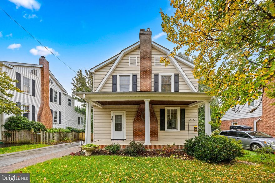 Welcome to 307 E Lake Avenue, located in the highly sought-after community of Historic Cedarcroft! This 4-bedroom, 2-bathroom home, built in 1926, perfectly blends timeless charm with thoughtful modern updates. As you approach, the covered front porch immediately invites you to enjoy a morning coffee or unwind in the evening. Inside, gorgeous hardwood floors complement a traditional layout featuring a spacious living room, dining area, kitchen, mudroom, a versatile bedroom or office, and a full bathroom. The kitchen has been beautifully updated with soft-close cabinetry, stone countertops, stainless steel appliances, and a stylish tile backsplash. A cedar pantry adjacent to the breakfast nook provides additional storage and leads to a large covered and screened back deck. This 3-season room is a true oasis and is sure to become a favorite space in the home. From here, step down to the flat, fenced backyard featuring flowering plants and a fig tree during warmer months. A potential butler’s pantry offers convenient storage between the kitchen and living area, while a bonus room on the main level can serve as a fourth bedroom or additional living space conveniently located next to the full bathroom. Upstairs, you’ll find three generously sized bedrooms, including an oversized primary suite. There is a full bathroom, an additional walk-in closet, and a bonus room off one of the bedrooms. Natural light fills every room, and storage is abundant throughout the home including a walk-up attic and unfinished basement. Additional features include a 2-car garage and ample parking. Recent updates include fresh paint (2025), new garage door (2025), basement waterproofing (2025), kitchen appliances (2022), main level bathroom renovation (2020), water heater (2019), and a full kitchen renovation (2017), among others. This home seamlessly combines classic charm with modern comfort. Just a short walk to Belvedere Square and minutes from shopping, dining, and community amenities, it truly is a one-of-a-kind gem.. Welcome home!