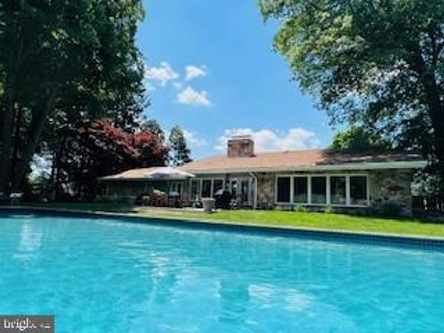 Private 1-Acre Lot in Desirable West Chester Boro – Walk to Restaurants & Shops
This newly renovated ranch-style home offers the perfect blend of luxury and comfort with 3,236 sq. ft. of thoughtfully designed living space. Set on a private 1-acre lot with an in-ground pool, expansive patio, an elevator to the lower level and a 3-car garage, the property provides a rare combination of privacy and convenience within walking distance to the heart of West Chester.
Inside, the home features hard wood flooring, two fireplaces, and abundant natural light. The gourmet kitchen is equipped with high-end Thermador appliances, marble and soap stone countertops and custom cabinetry—ideal for entertaining.
The home includes 4 bedrooms and 5.5 bathrooms (1 full bath in pool house).  Additional highlights include a main floor laundry and an expansive finished basement.