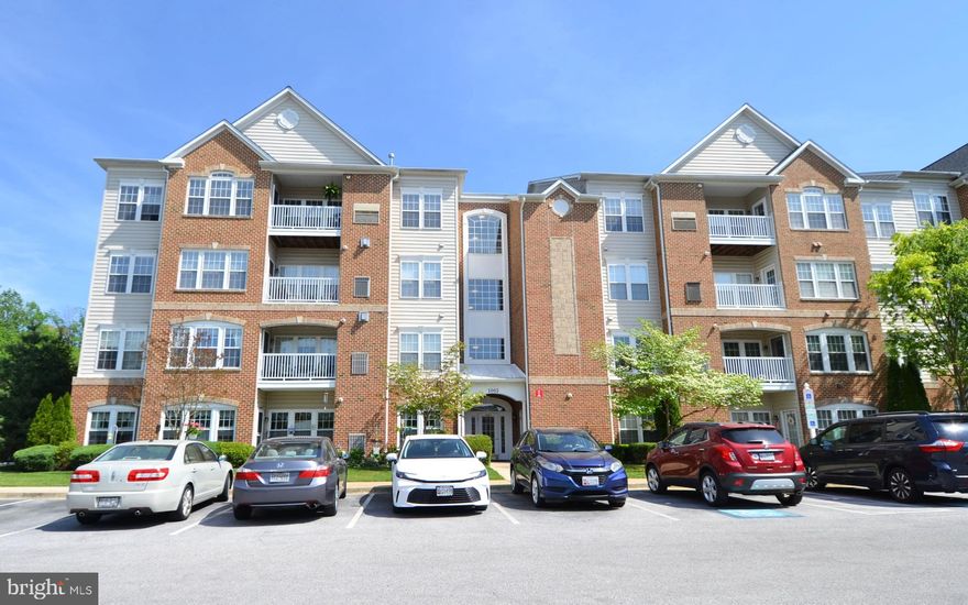 This spacious top-floor condo is located in a secure, elevator building within a vibrant 55+ active adult community. As you enter, you'll be welcomed by an open, airy layout enhanced by large windows and vaulted ceilings. The tiled foyer features both a walk-in closet and a coat closet, providing ample storage space.

The open-concept living and formal dining areas are filled with natural light and offer plenty of room for relaxing or entertaining, all accented by neutral carpeting. The fully equipped kitchen includes 42-inch cabinets, granite countertops, stainless steel appliances, and a pantry, along with a bright breakfast nook that leads to a private balcony—perfect for enjoying your morning coffee. You'll also find a convenient laundry closet with a full-size washer and dryer nearby.

At the rear of the unit, the expansive primary suite features vaulted ceilings, a cozy sitting area, a large walk-in closet, and a private bath with a dual-sink vanity and a walk-in shower with a built-in bench. A generously sized second bedroom offers a ceiling fan and great closet space, along with easy access to the second full bathroom.

Relax outdoors on your private balcony, or take advantage of the community center, which hosts a variety of activities and amenities. Ideally situated between Annapolis and Baltimore, this location also offers easy access to shopping, dining, and more.