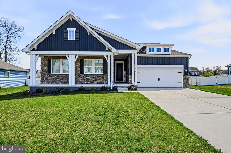 Nestled in the prestigious Satterfield subdivision, this exquisite ranch-style residence, embodies the pinnacle of modern luxury living. No need to wait for new construction, this 2 year old, 3 Bedroom/2 Bath home with a front porch, offers a harmonious blend of elegance and functionality, perfect for those who appreciate high-end finishes and thoughtful design. As you step inside, you are greeted by an expansive open floor plan with LVP flooring that seamlessly connects the living spaces, accentuated by exposed beams that add a touch of rustic charm. The family room, conveniently located off the kitchen, is bathed in natural light, and is designed for both relaxation and entertaining, featuring a cozy gas fireplace that serves as the focal point, inviting warmth and ambiance. The combination kitchen/dining room is perfect for intimate gatherings or enjoying casual meals. But the heart of the home is undoubtedly the gourmet kitchen, designed for culinary enthusiasts. Featuring upgraded Quartz Soapstone countertops, a spacious island, a country-style layout, double ovens, 42" inch cabinets, soft closing drawers, tile backsplash, water conditioner, reverse osmosis, and a custom range hood. The eat-in area is perfect for casual dining, while the pantry ensures ample storage for all your culinary needs. Recessed lighting enhances the kitchen's allure, illuminating every detail of this culinary haven. Retreat to the luxurious master suite, where comfort meets elegance. The thoughtfully designed layout includes an entry-level bedroom, with a tray ceiling, LVP flooring, ceiling fan, and remote control blinds ensuring convenience and accessibility. The master bath features a walk-in tiled shower, offering a spa-like experience in the comfort of your own home along with a walk-closet, ceramic floor tile, and remote control blinds. Additional two bedrooms provide versatility for guests, catering to your lifestyle needs along with another full hall bath. There is also a versatile area that could be used as a possible office, playroom or storage. The main floor laundry adds to the home's practicality, making daily chores a breeze. Off of the dining room there is a spacious 32x10 screened-in porch with recessed lighting and treks flooring for relaxation. Outside, the property boasts a generous .35-acre lot, providing ample space with partial fencing for outdoor activities or future landscaping dreams. The attached garage, with space for two vehicles, along with a double driveway accommodating 4-6 additional cars, ensures that parking is never a concern. Additional features include a 4.5 ft high climate conditioned crawl space, and an Irrigation system. Close to Killens Pond State Park, the Delaware beaches and RT 1, this home is not just a residence; it is a lifestyle choice, offering the perfect blend of luxury, comfort, and modern convenience. Embrace the opportunity to make this exceptional property your own and indulge in the exclusive lifestyle it offers. Put this one on your tour today!