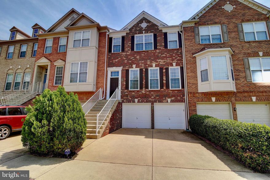 4 BR 3.5 BA townhouse w/over 2300 sq ft, 2 car gar., eat-in kit. w/granite, stainless steel appliances, FP in family room, rec room, 4th BR and full BA in lower level.  Luxury master suite w/ spacious bath & walk-in closet.  The rear garden is a maintenance free oasis to relax or entertain.  Other features include lrg deck, tray ceilings, HWF. Close to shopping, metro and commuter routes.
